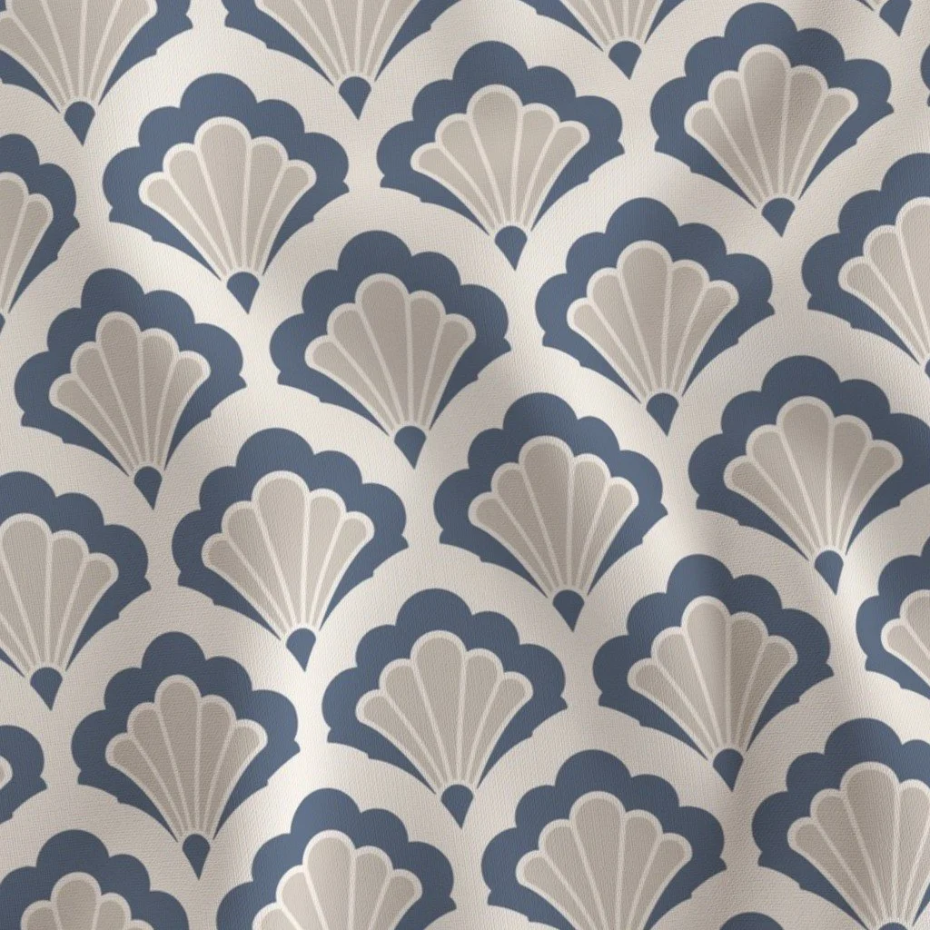 Close-up view of a patterned wallpaper with a repeating design of stylized shells in blue and beige colors.