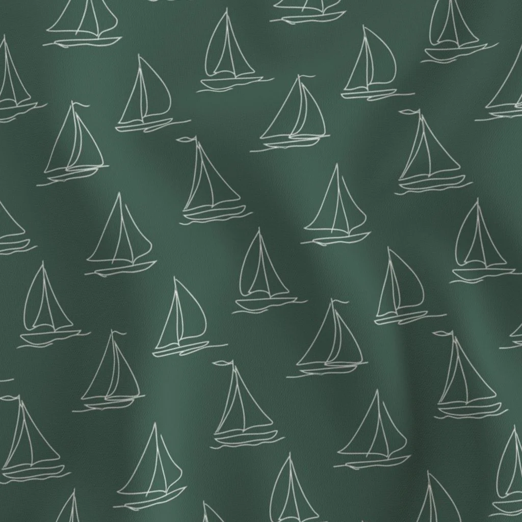 Repeating pattern of white sailboats on a dark green background.