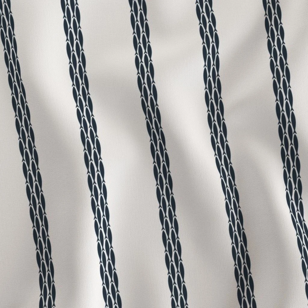 Close-up of a fabric with white and navy-blue vertical stripes featuring a geometric chain-link pattern.