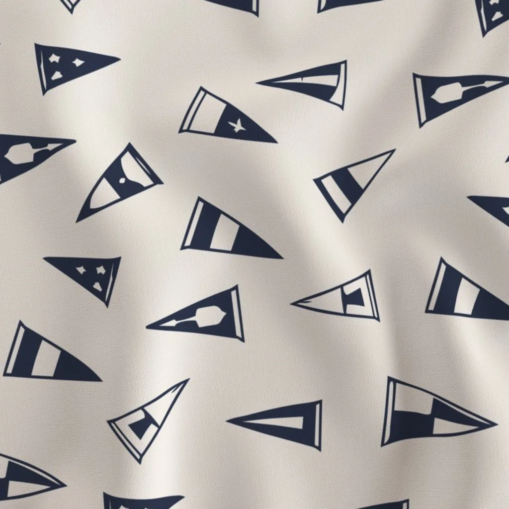 Close-up of a fabric with a pattern of navy blue pennant flags on a white background.