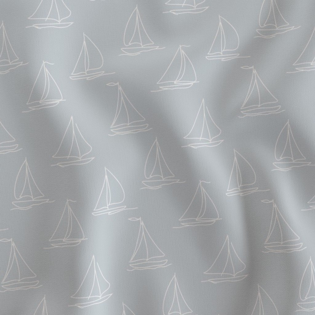 Light blue fabric with white sailboat pattern.