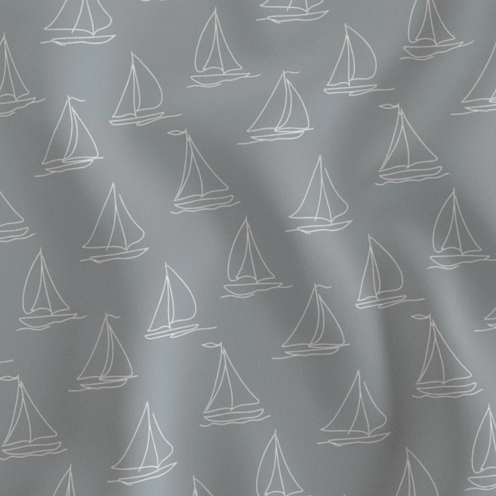 Gray fabric with white line drawings of sailboats.