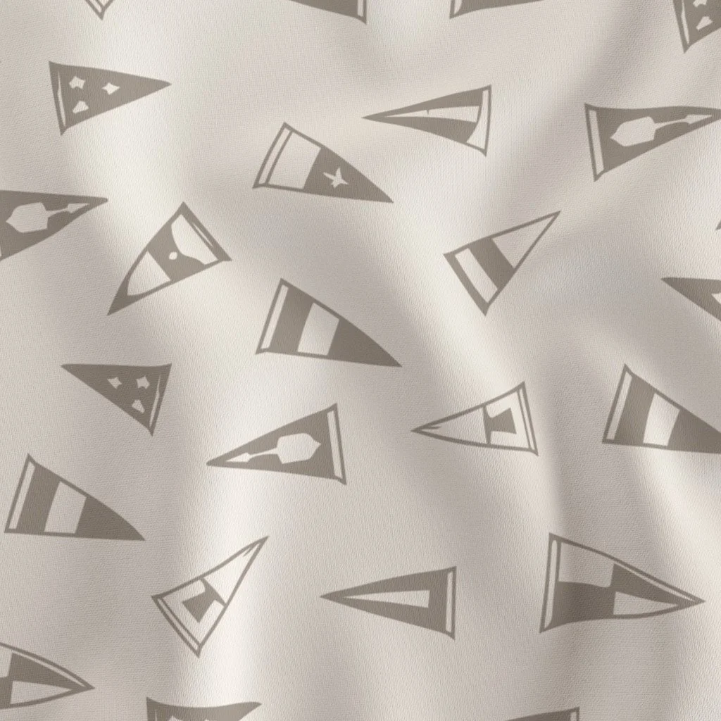 Pattern of gray triangular flags with various flag designs on a white fabric background.