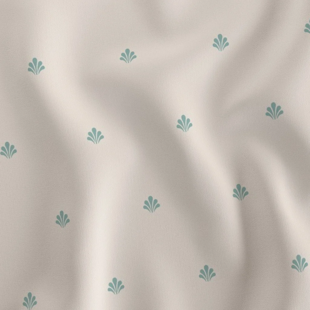 Close-up of a white fabric with a pattern of small blue decorative motifs, some showing slight wrinkles or folds.