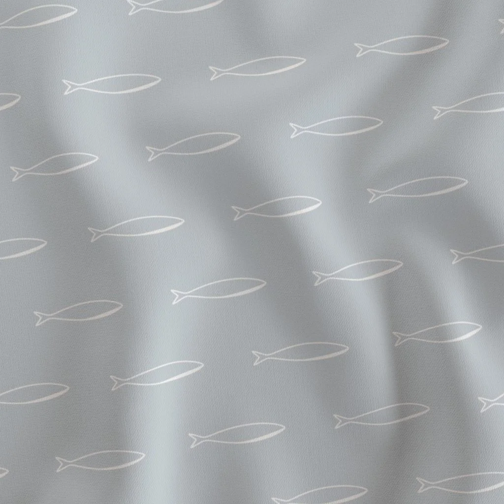 Light blue fabric with a pattern of small white fish outlines.