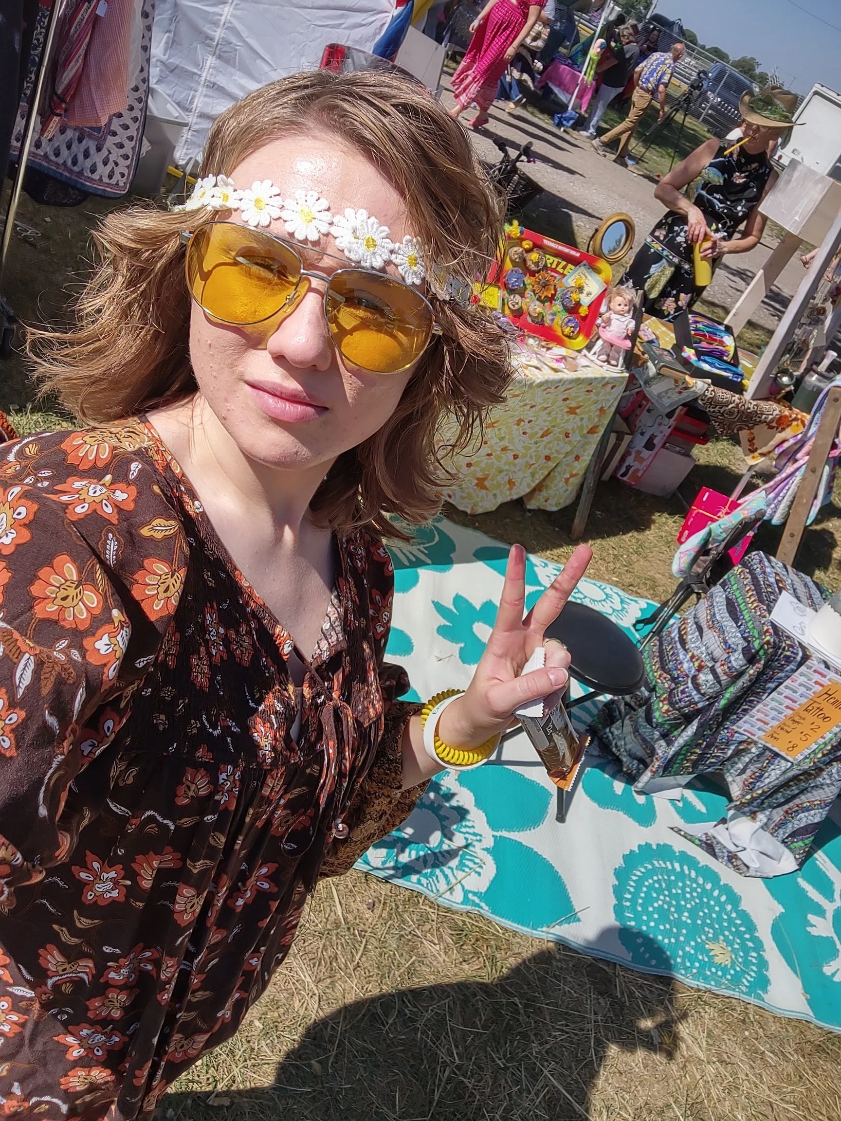 Year 2 of Hippie Fest (2023). Posing in front of our booth!