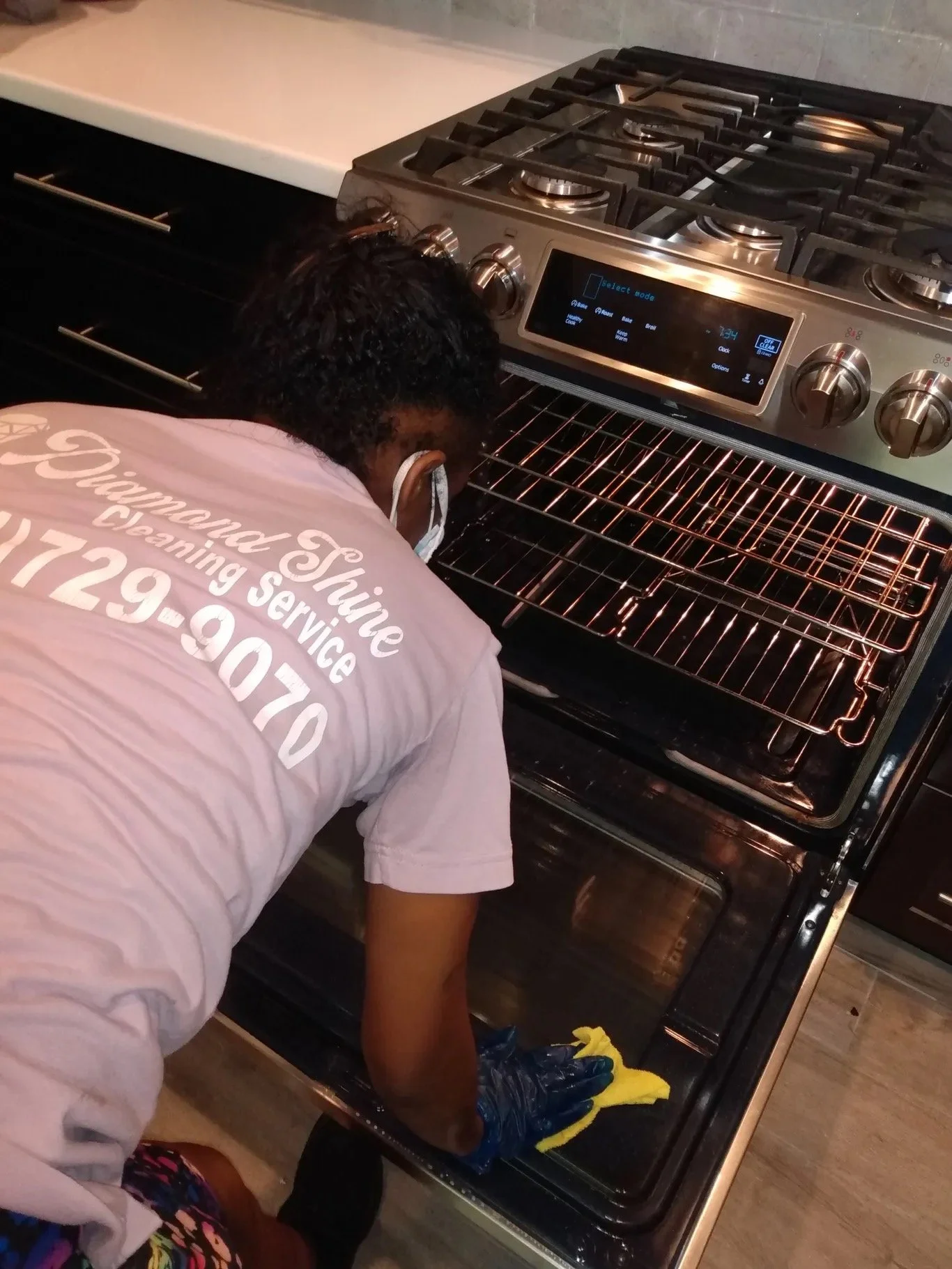 Rosland owner cleaning the oven