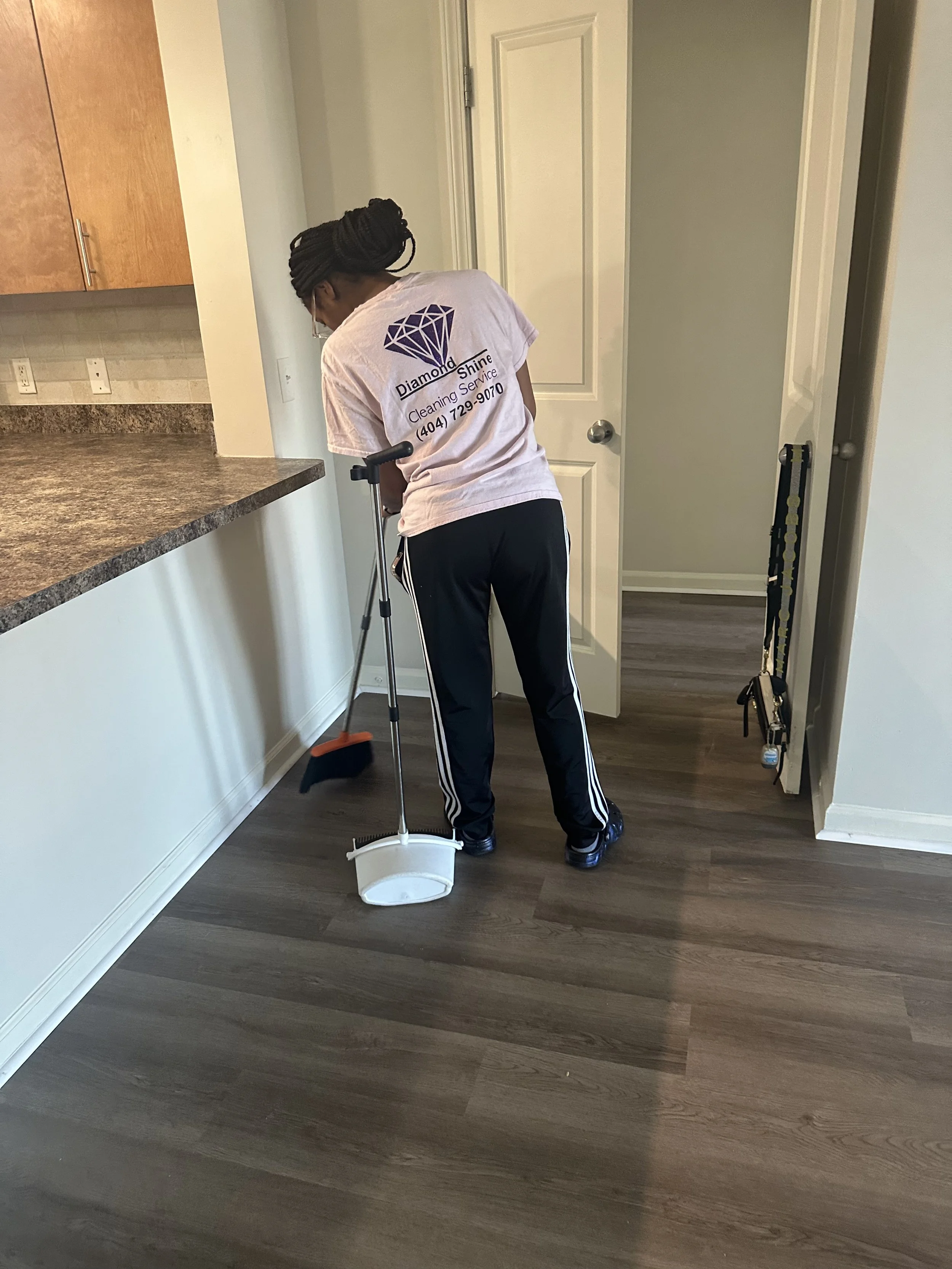 Michael technician sweeping up before mopping
