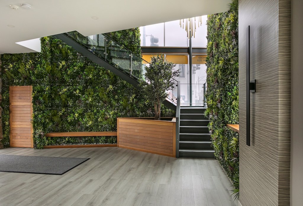 chicago-modern-corporate-office-lobby-moss-wall-wood-panel-staircase.jpg