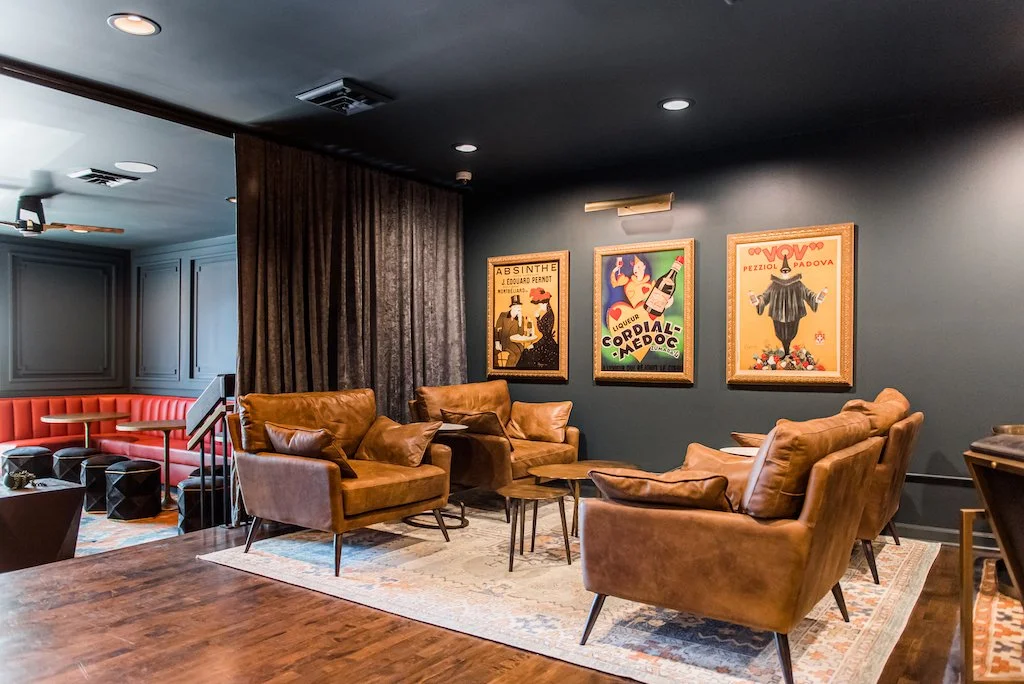 east-dundee-restaurant-industrial-lounge-leather-couch-vintage-poster-wall-art.jpg