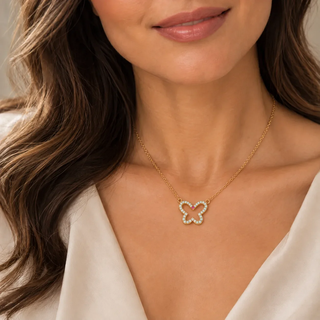 Opal cut-out butterfly necklace worn