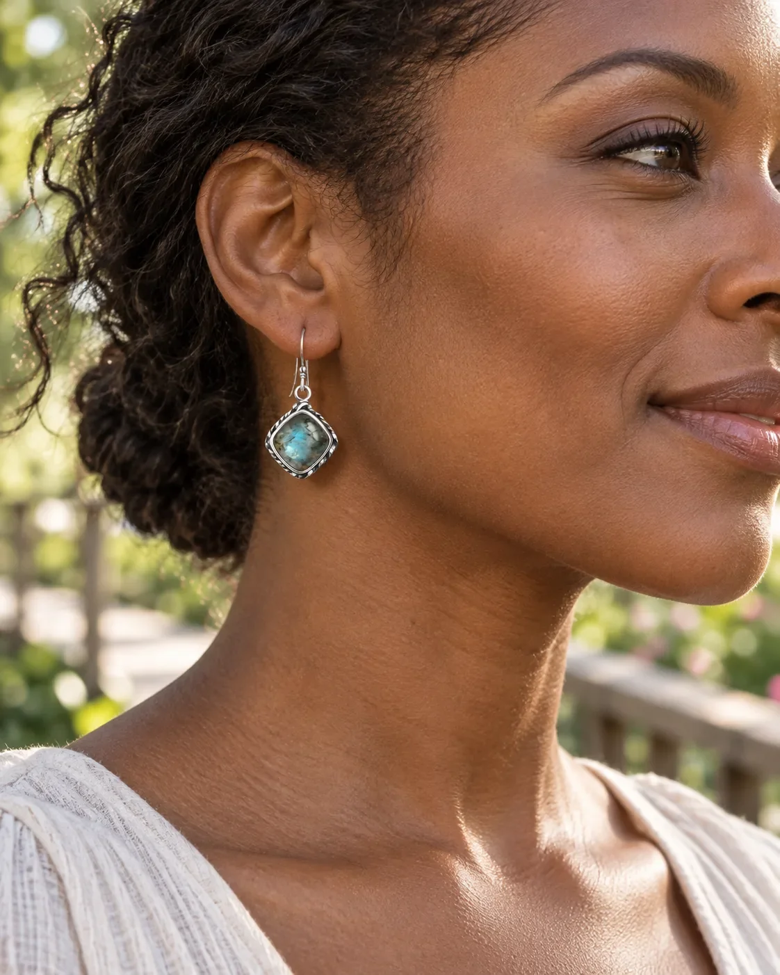 Labradorite dangle earrings worn on ear