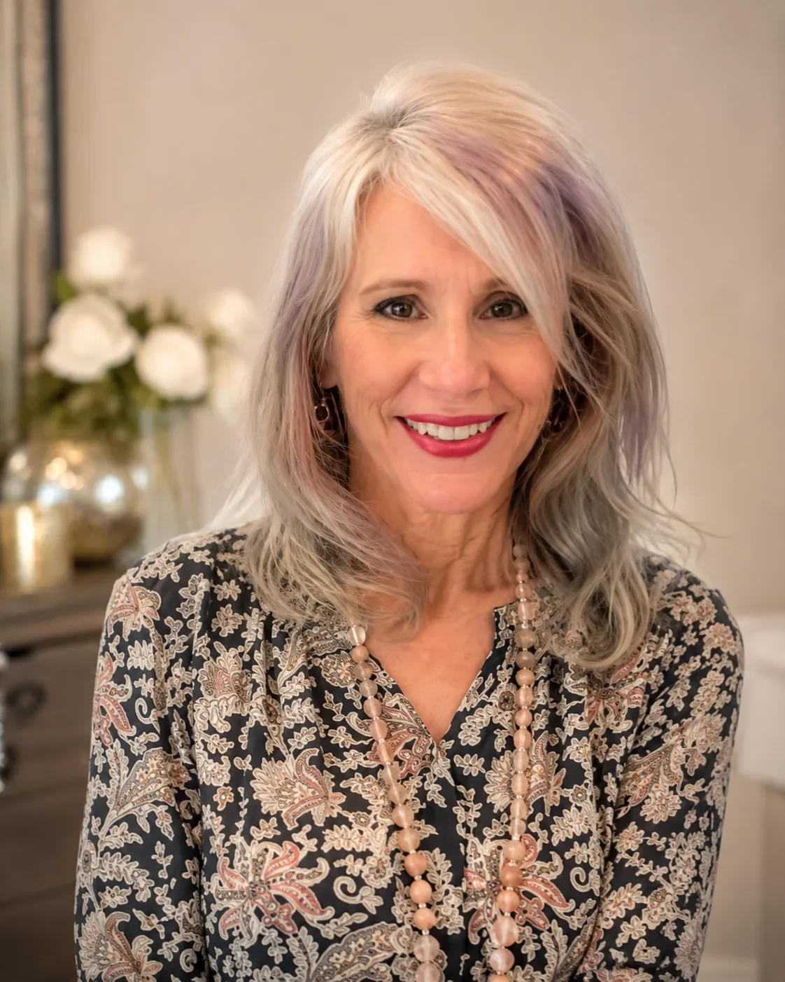Portrait of Cat, founder of Cat V. Atelier, wearing a long beaded necklace