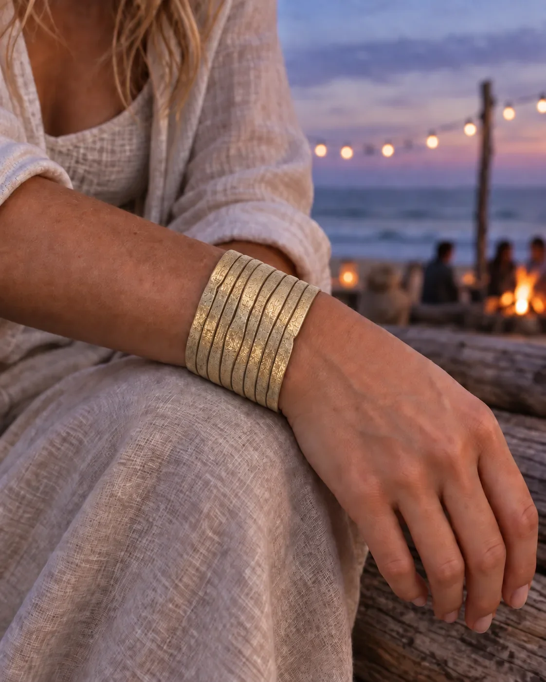 Metallic champagne gold leather cuff bracelet worn on wrist