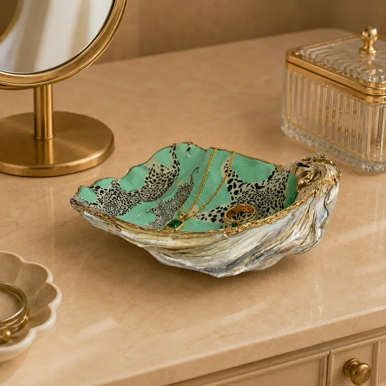 Green leopard ceramic jewelry dish styled on vanity