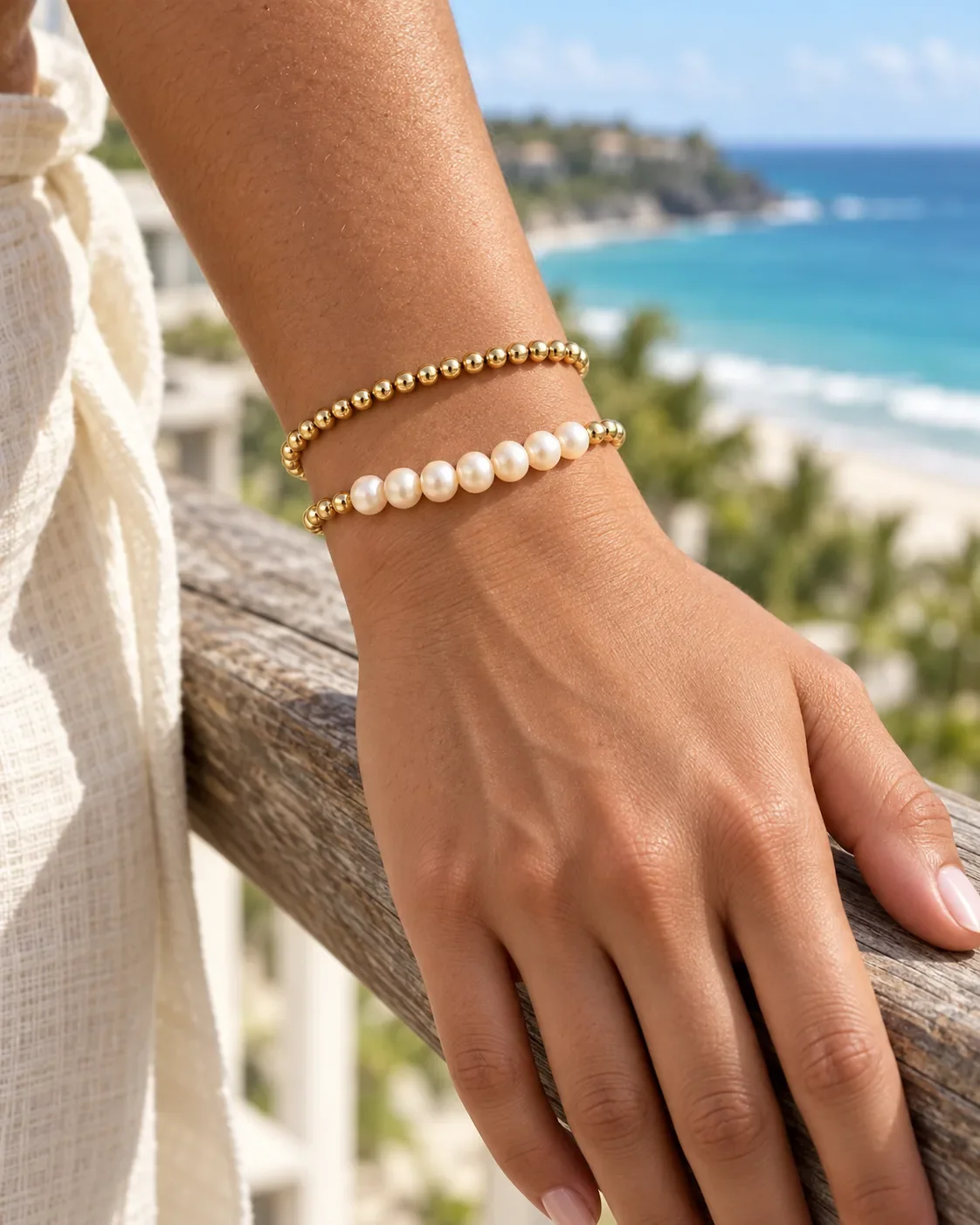 Freshwater pearl and gold bead bar bracelet worn on wrist