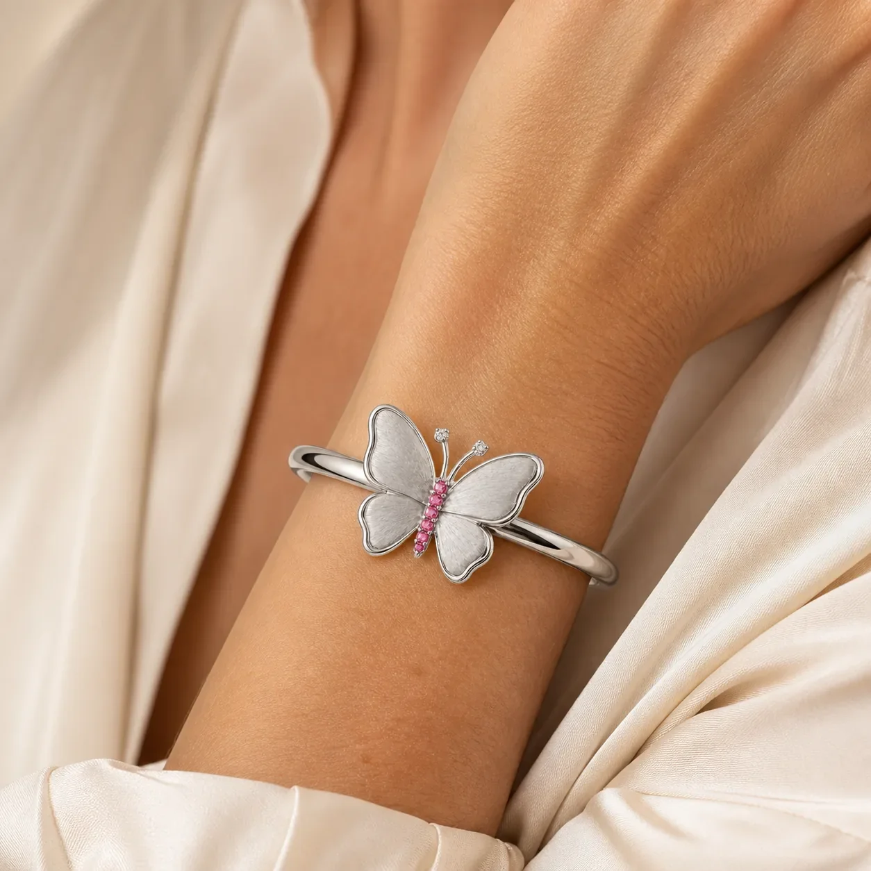 Butterfly pink tourmaline cuff worn on wrist