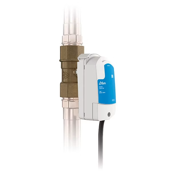 A water flow sensor connected to a copper pipe.