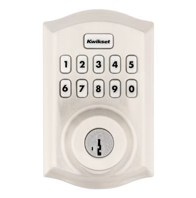 Wireless keypad with numeric buttons and a small round sensor, labeled 'Kwikset' for home security or access control