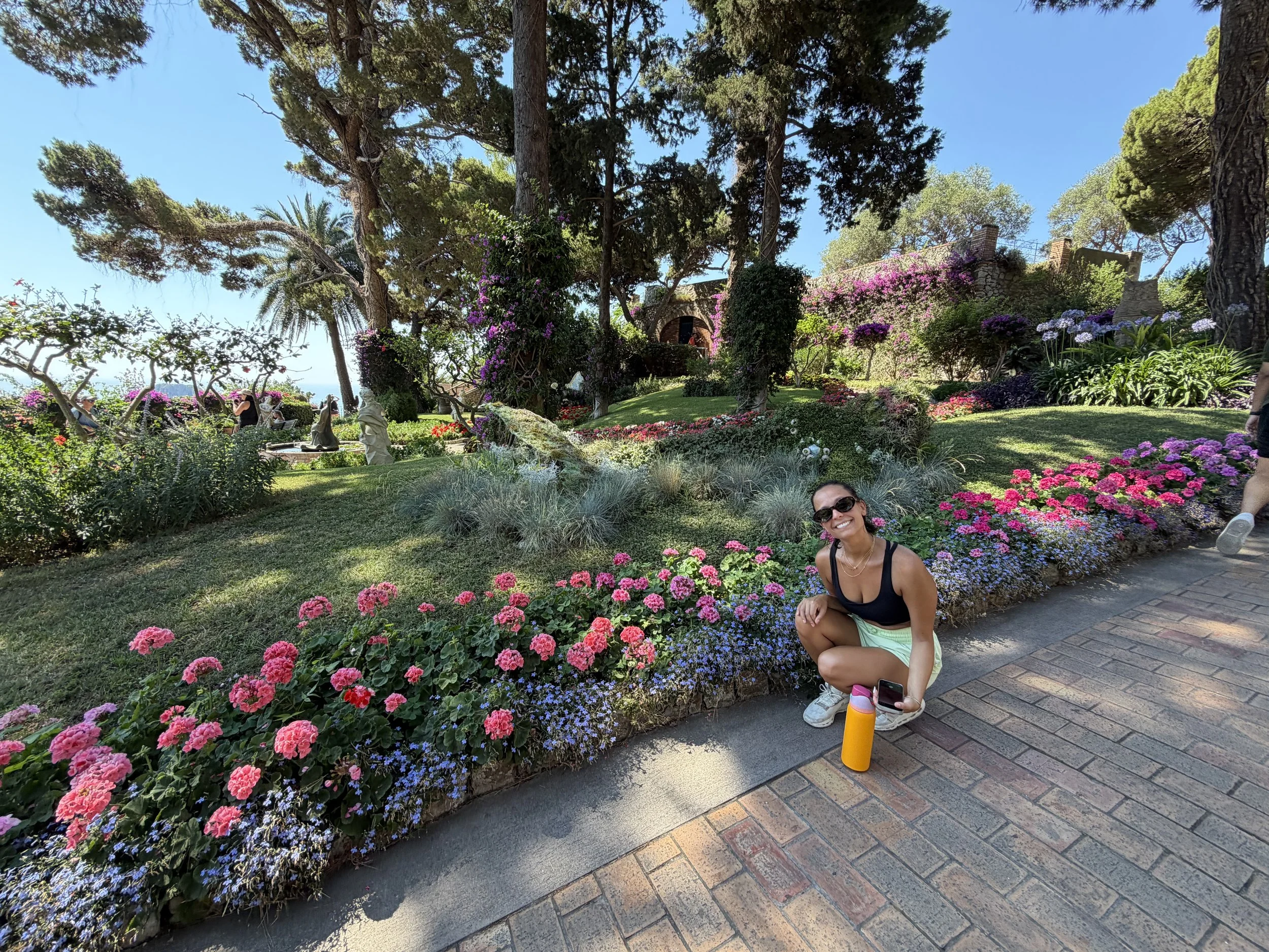 smiling kind woman with colorful flowers in new york city
