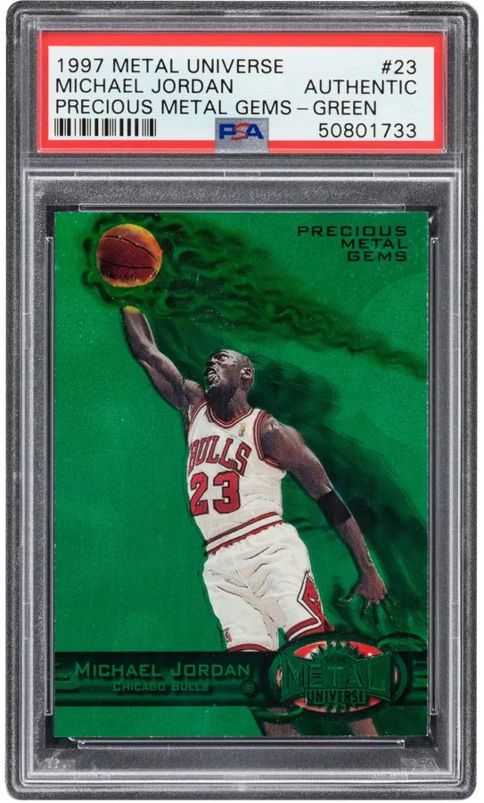 1997 Metal Universe basketball card featuring Michael Jordan in a Chicago Bulls uniform, holding a basketball, with green background and metallic design elements.