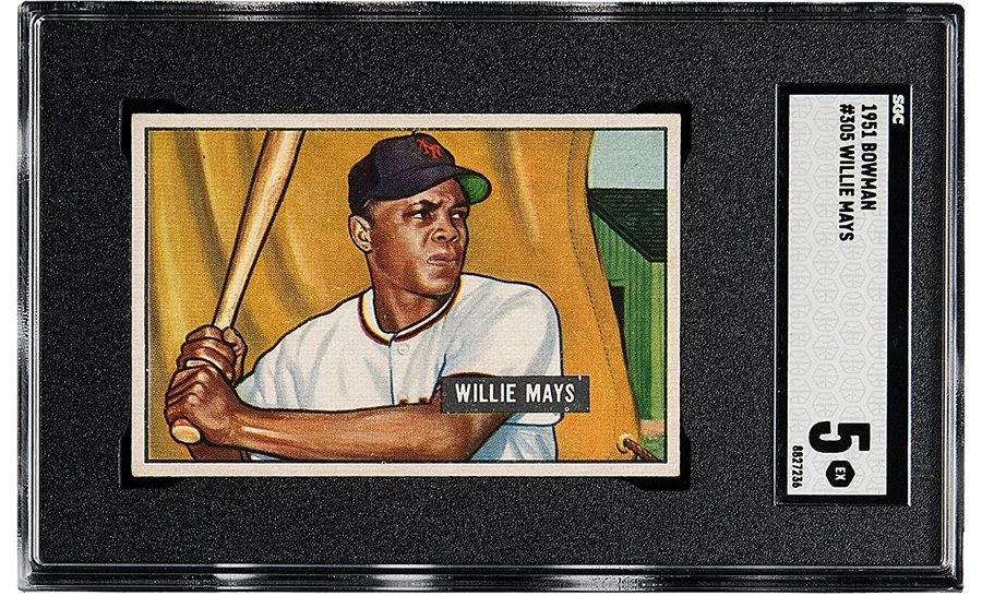 Vintage baseball card of Willie Mays holding a bat, in plastic case.