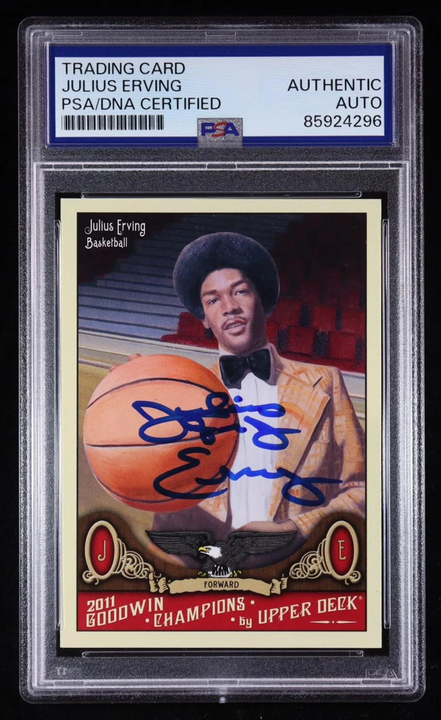 A signed Julius Erving basketball trading card in a protective case, certified authentic by PSA. The card features an illustration of Julius Erving holding a basketball, with text indicating he is a forward and a 2011 champion, from Upper Deck.