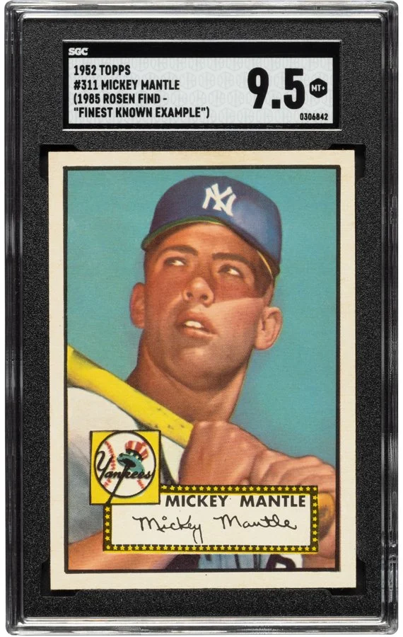 1952 Topps Mickey Mantle baseball card graded 9.5 by SGC, with a label indicating it is card #311 and features Mickey Mantle, identified as the 'Finest Known Example.' The card shows Mickey Mantle in a New York Yankees cap, holding a bat, with a vintage style design.