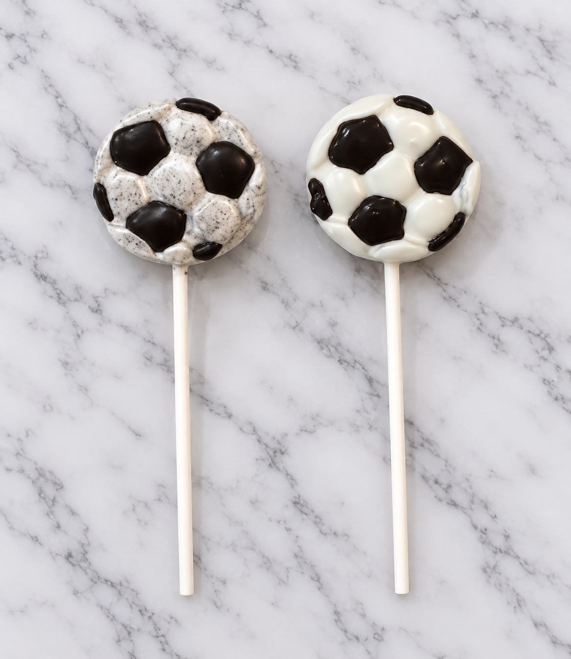 Soccer Ball Cake Pops on Marble.png