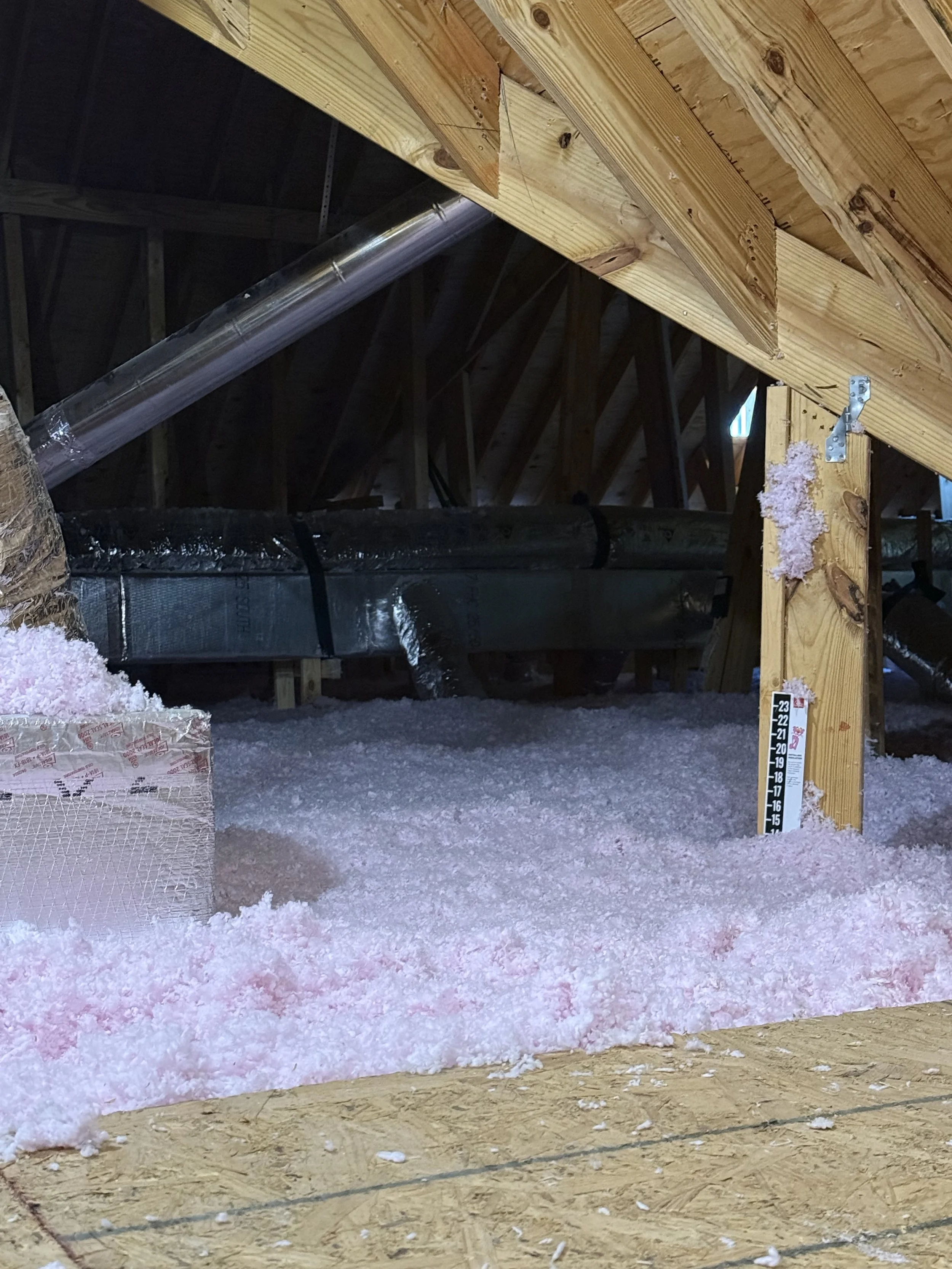 Newly installed blown fiberglass insulation in an attic, mobile county, baldwin county