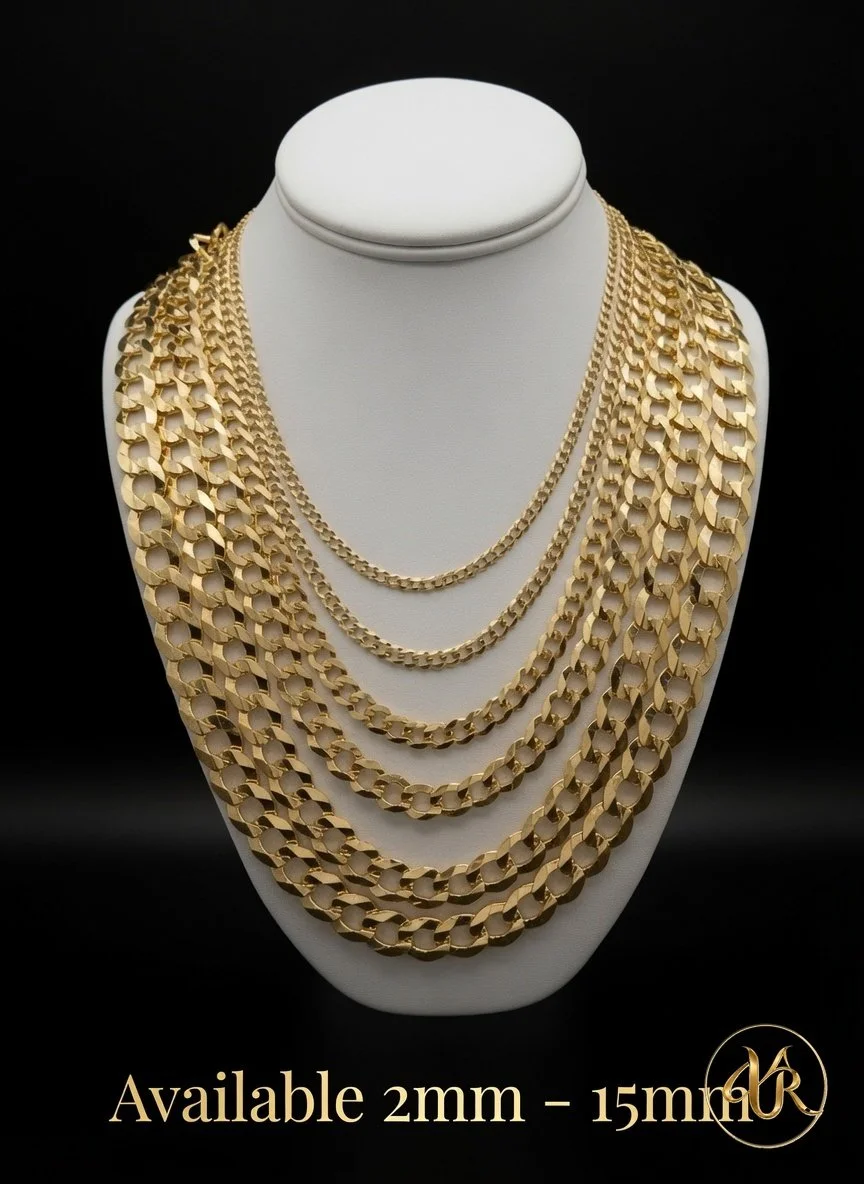 Multiple gold chain necklaces of varying thicknesses displayed on a white jewelry bust against a black background.
