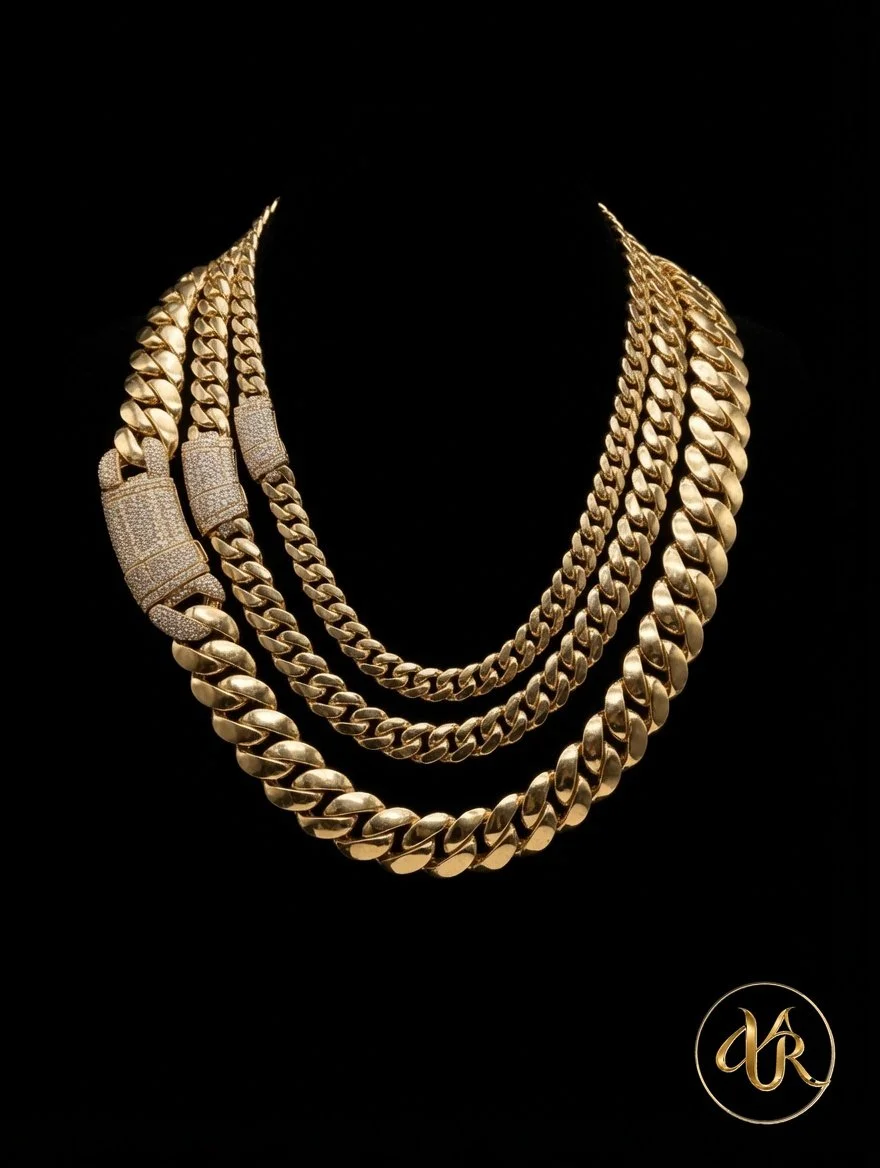 Multiple gold chains of varying thicknesses arranged in a layered display against a black background with a gold logo in the bottom right corner.