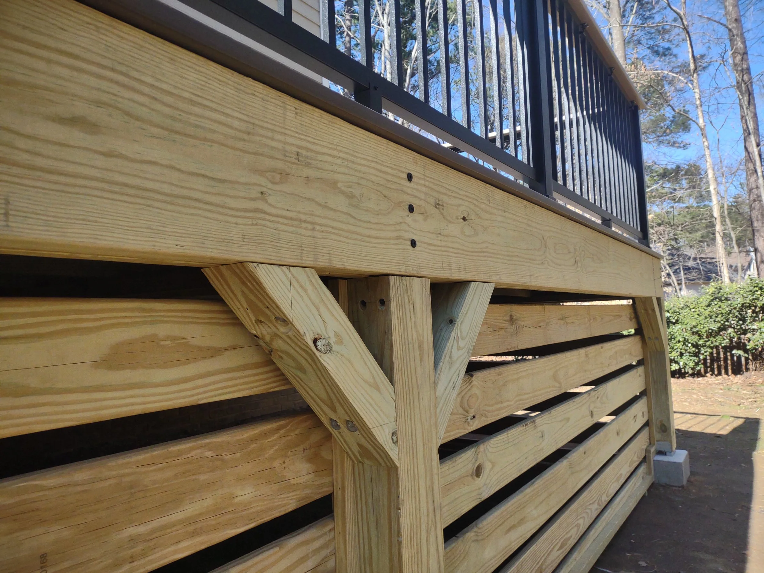 Custom deck with Timbertech PVC decking and railing and built with C.S. Consulting features