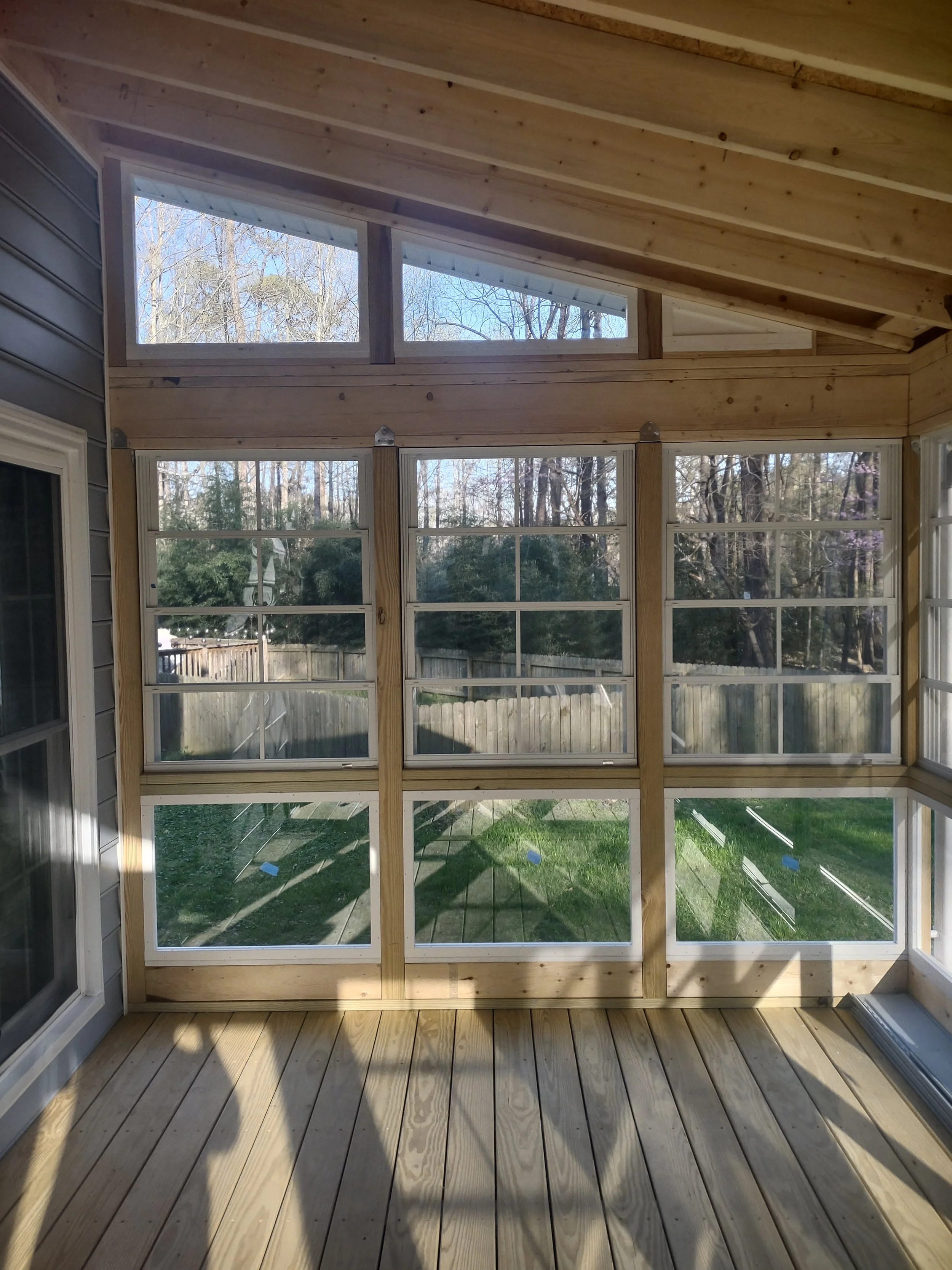The interior of this three season room is unfinished and exposes some of the quality of the construction