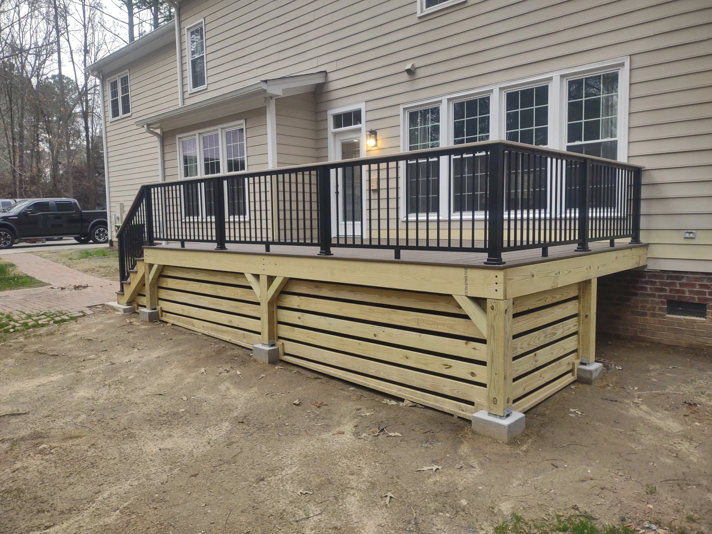 Custom deck with Timbertech PVC decking and railing and built with C.S. Consulting features