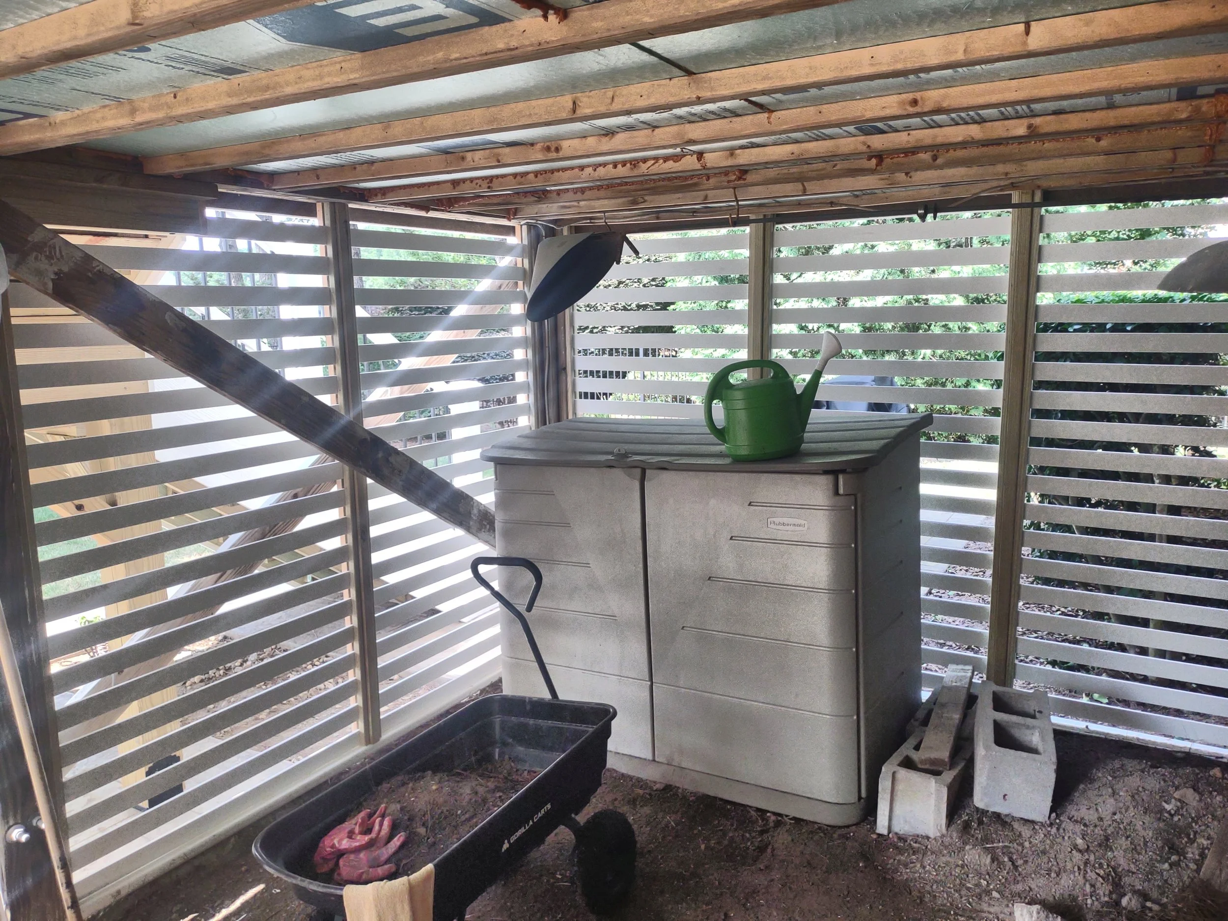 This is custom made expanded vinyl lattice enclosing the garden shed beneath the sunroom. The bottom frame board on the ground is  made from an Owens Corning product that is made from 100 polymer (HDPE) and will stand up to the elements and moisture 