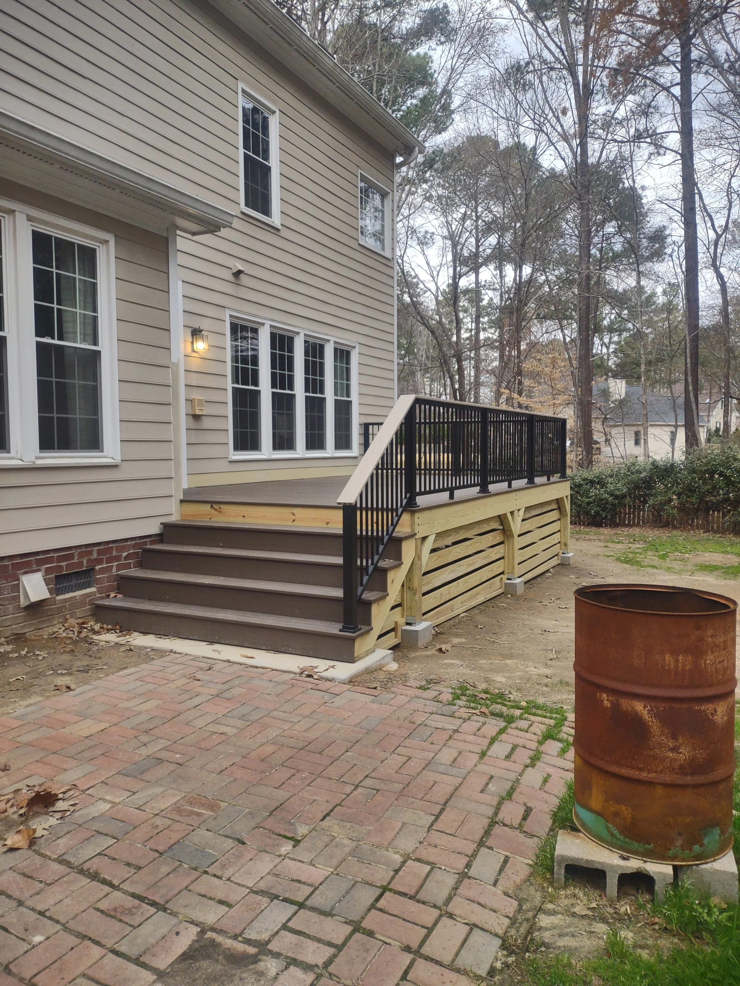 Custom deck with Timbertech PVC decking and railing and built with C.S. Consulting features