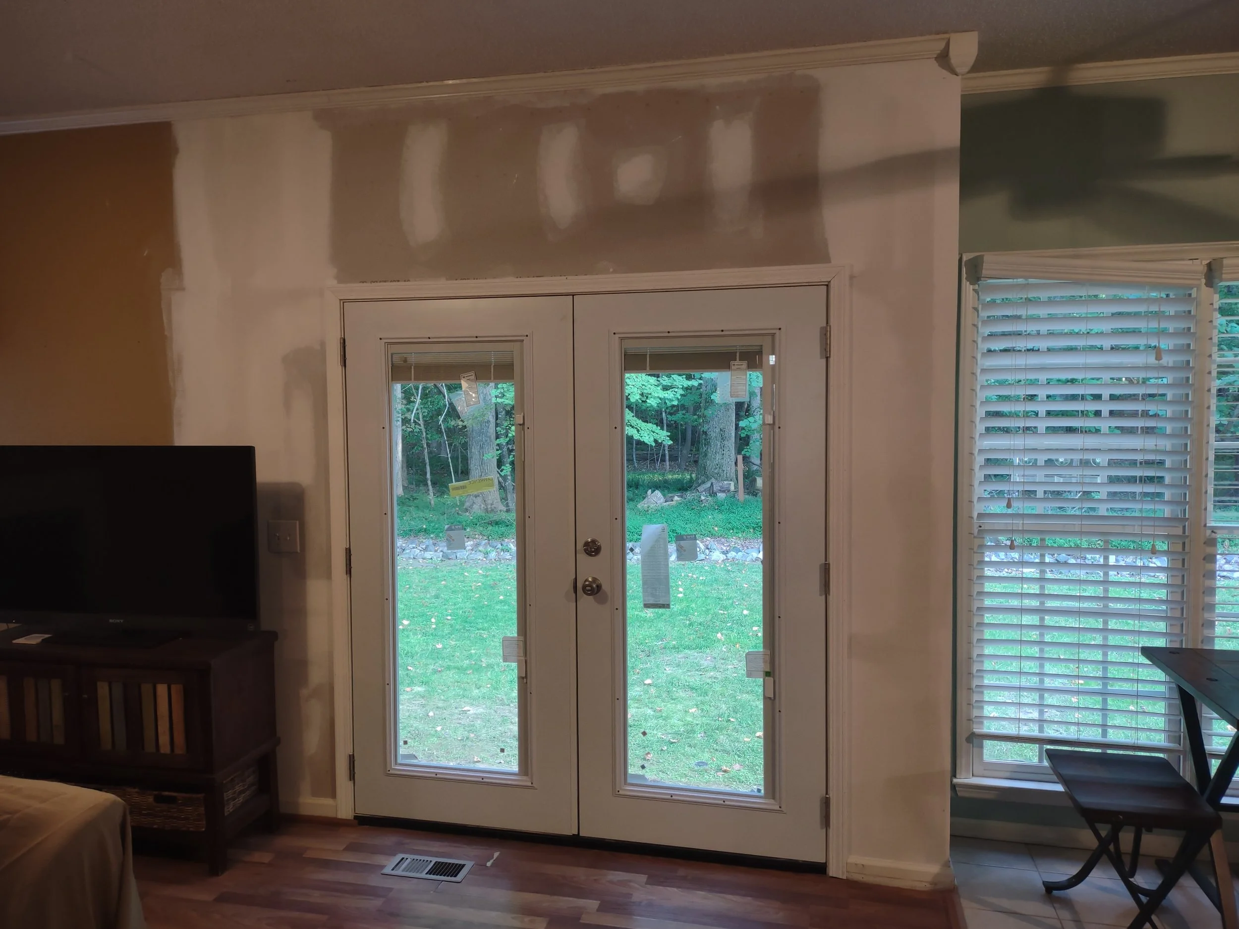 The new French door assembly has been installed
