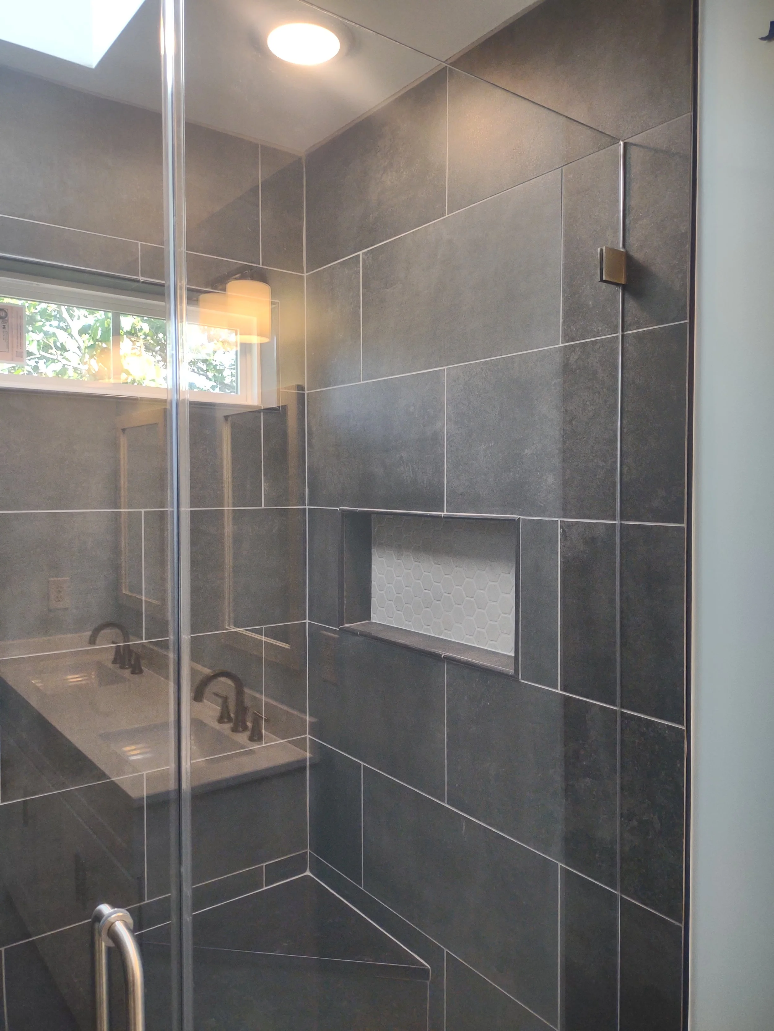 A master bath remodel emphasizing space efficiency and open feel