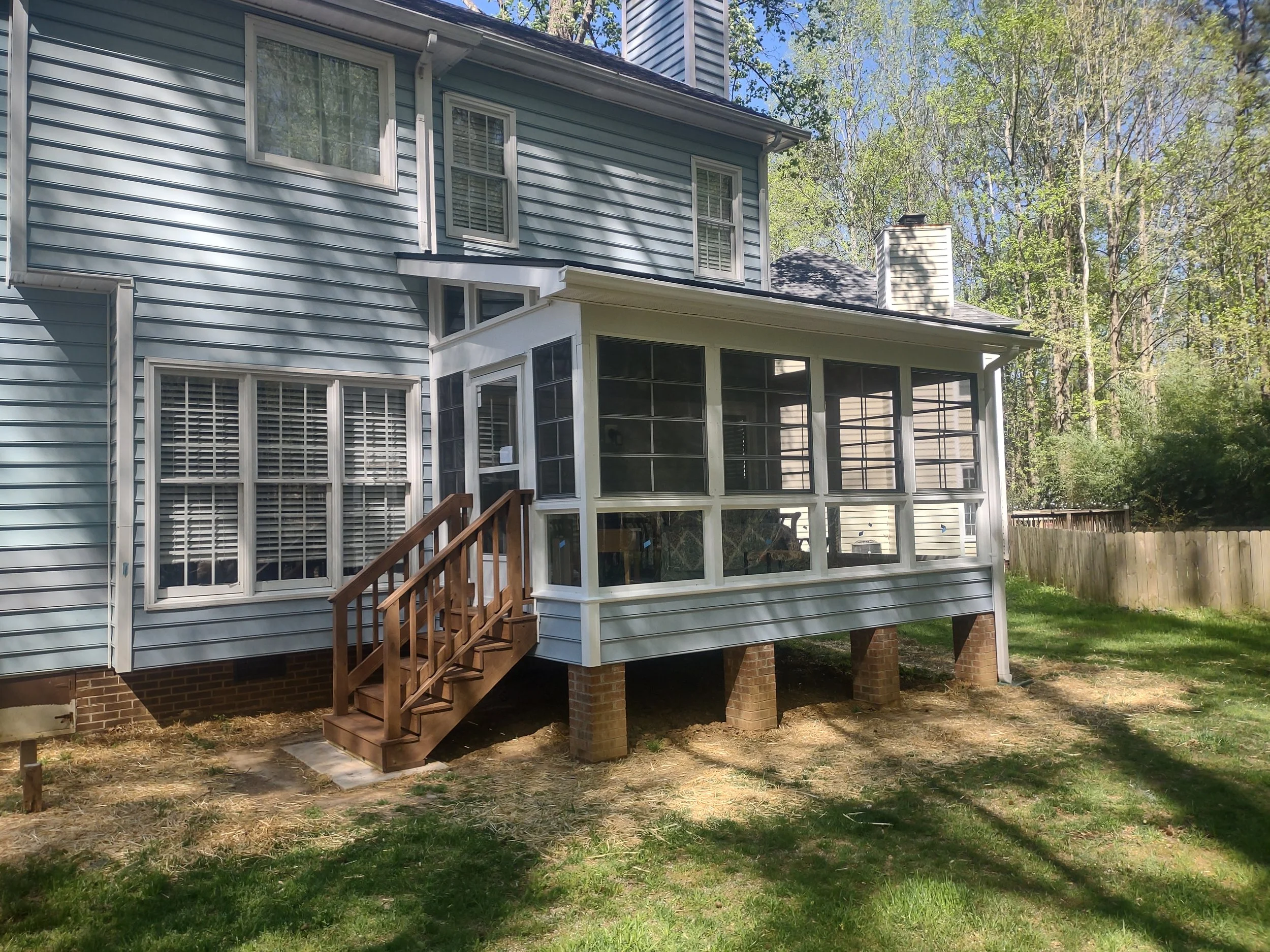 The exterior of the three season room is finished in steel clad and vinyl siding to tie into and match the home