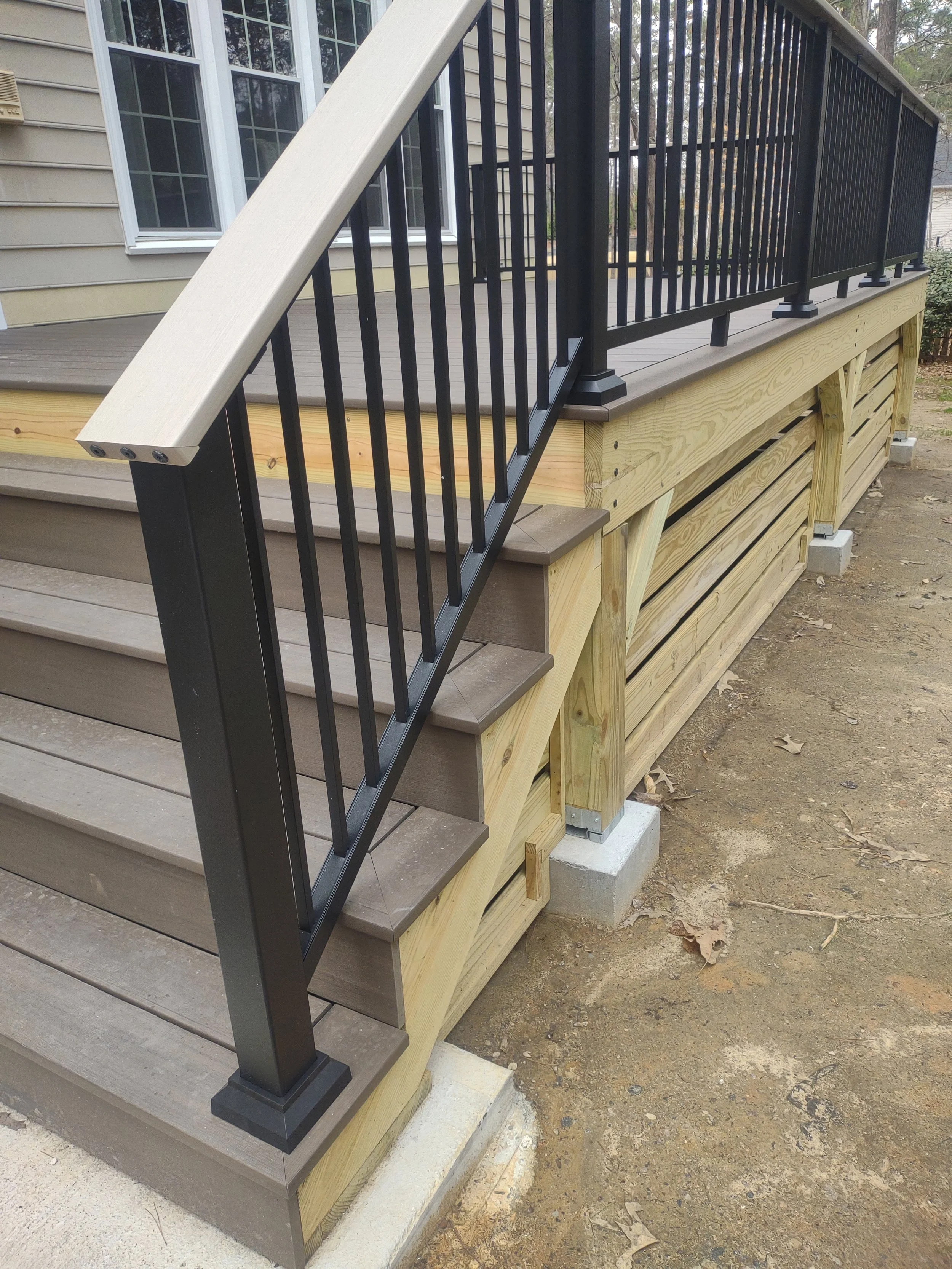 Custom deck with Timbertech PVC decking and railing and built with C.S. Consulting features