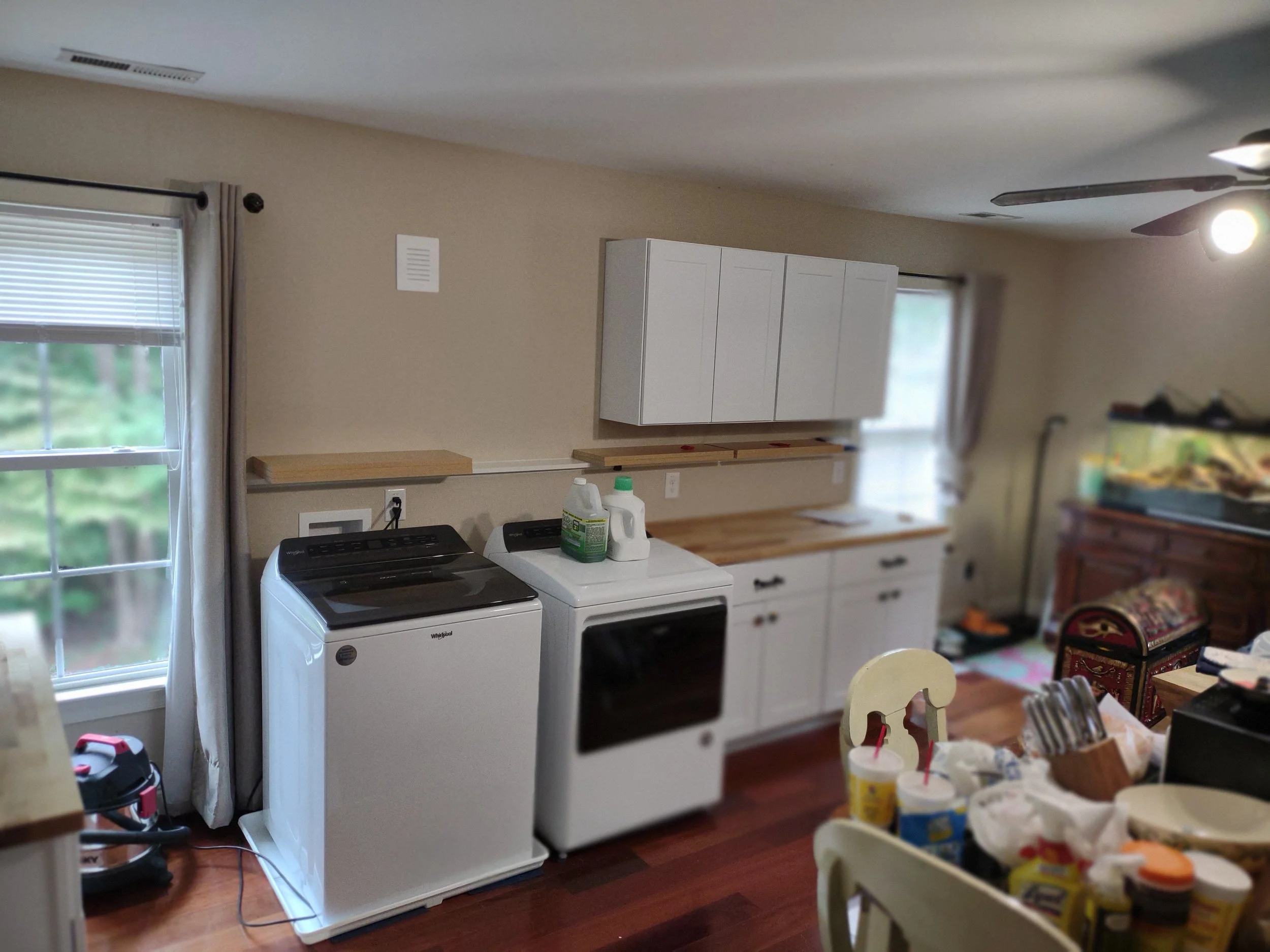Kitchenette and laundry added to above garage bonus room to create and efficiency living area.