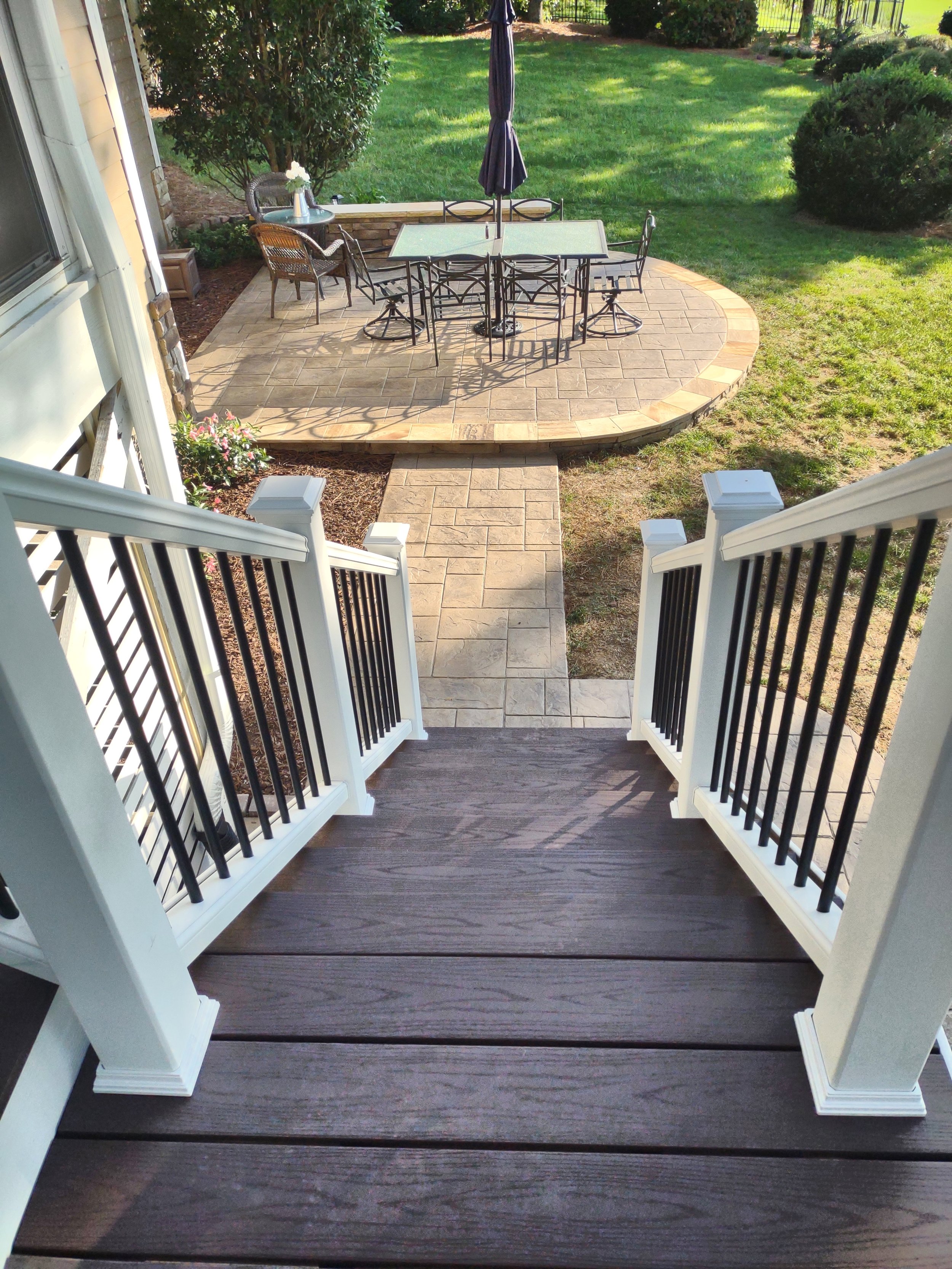 Premium dual staircase build with TimberTech treads and Trex railing. The decking and treads are fastened using TimberTech's hidden fastener system.