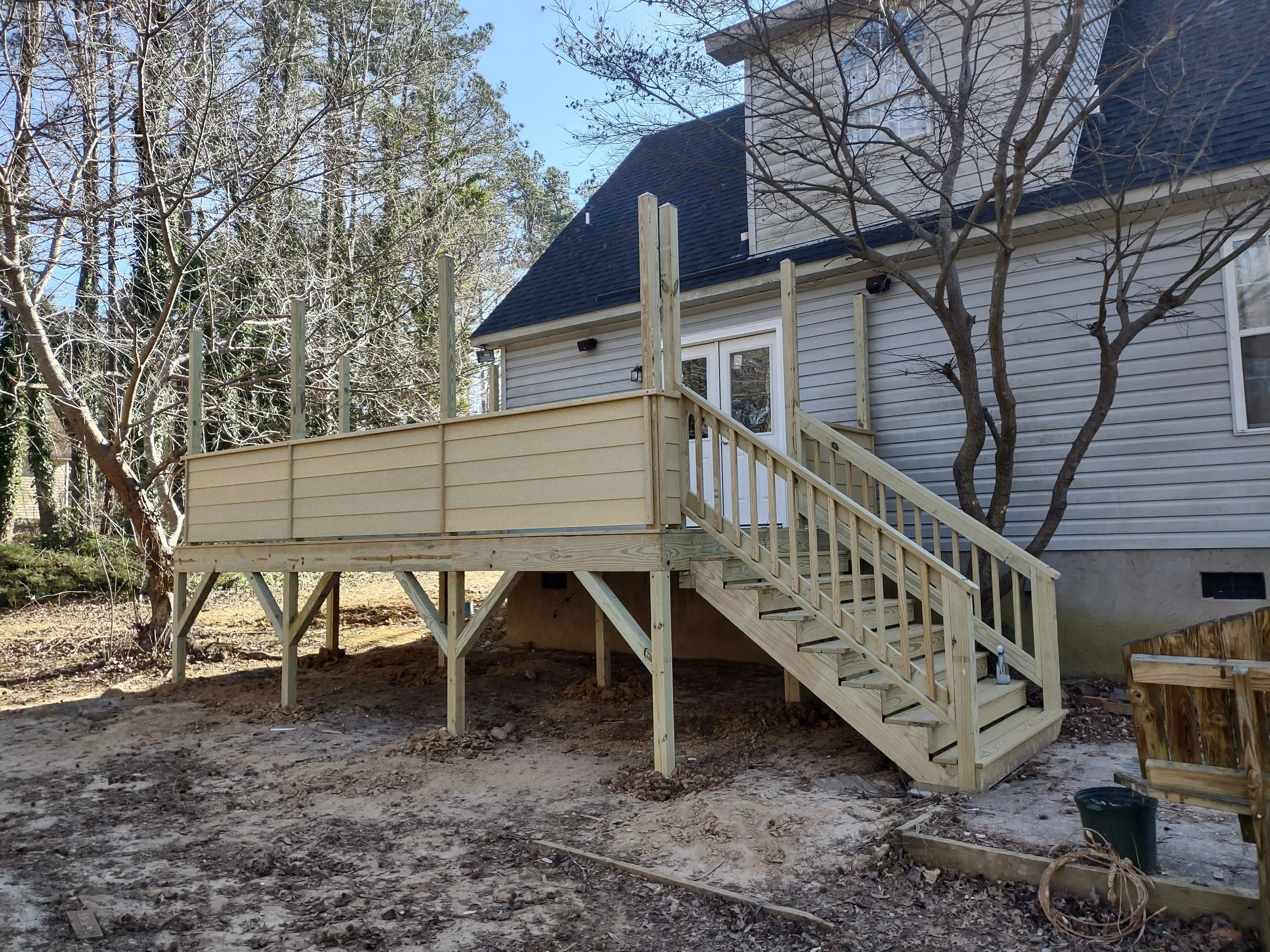 Custom deck built for privacy and with rope light posts built in by special request