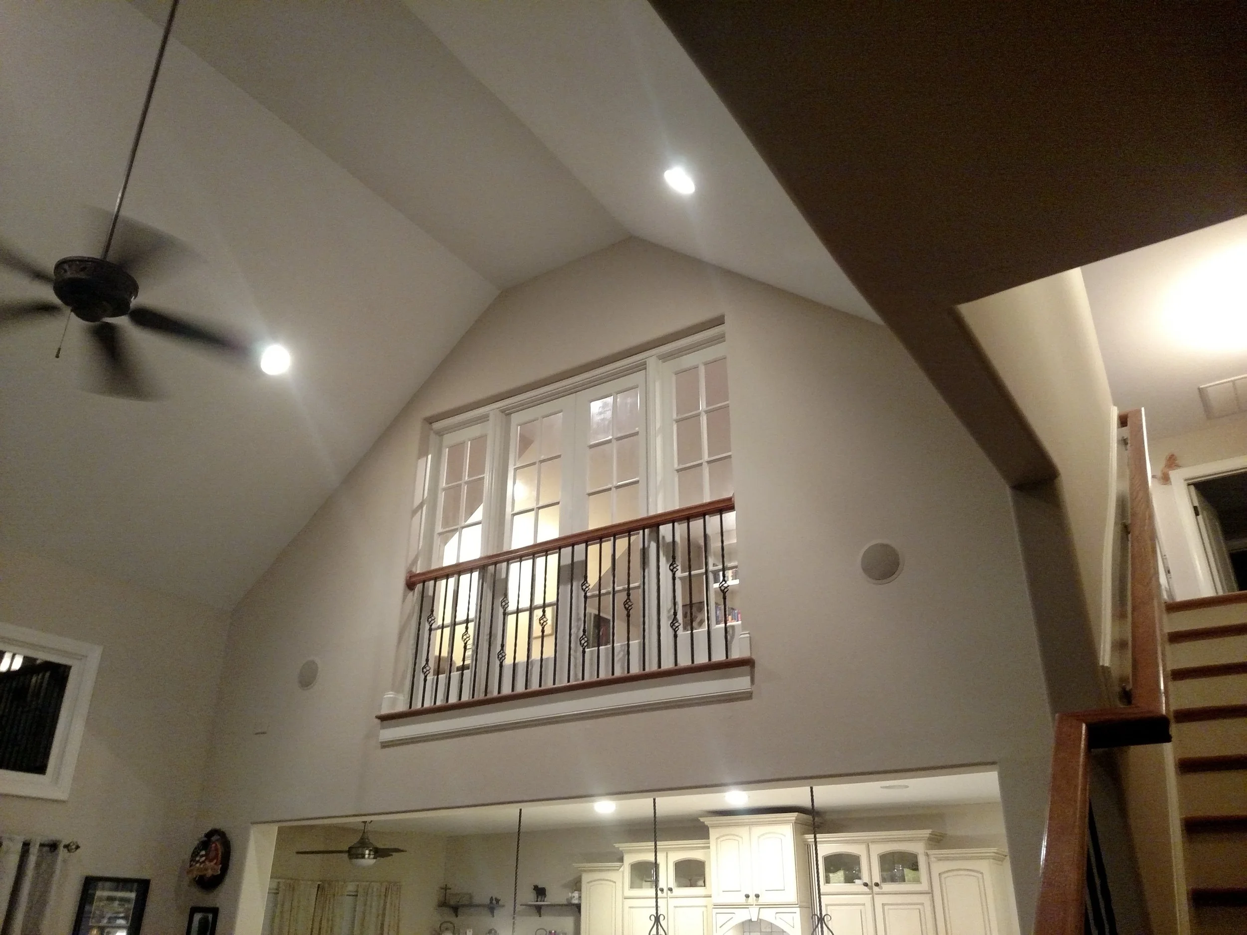 Custom 100+ year old barn wood used to create a custom heavy barn door and French door build out to promote privacy between floors