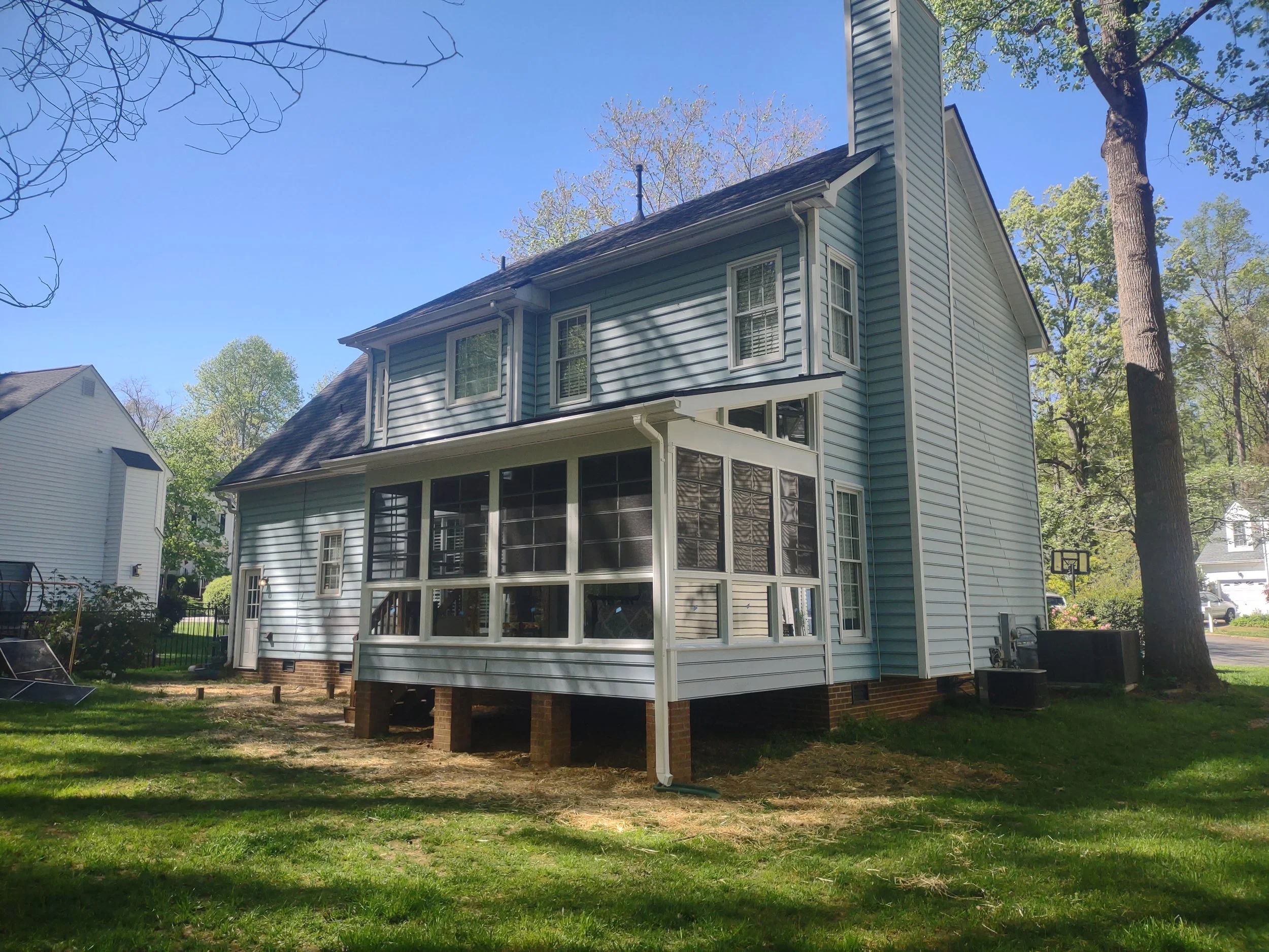 The exterior of the three season room is finished in steel clad and vinyl siding to tie into and match the home