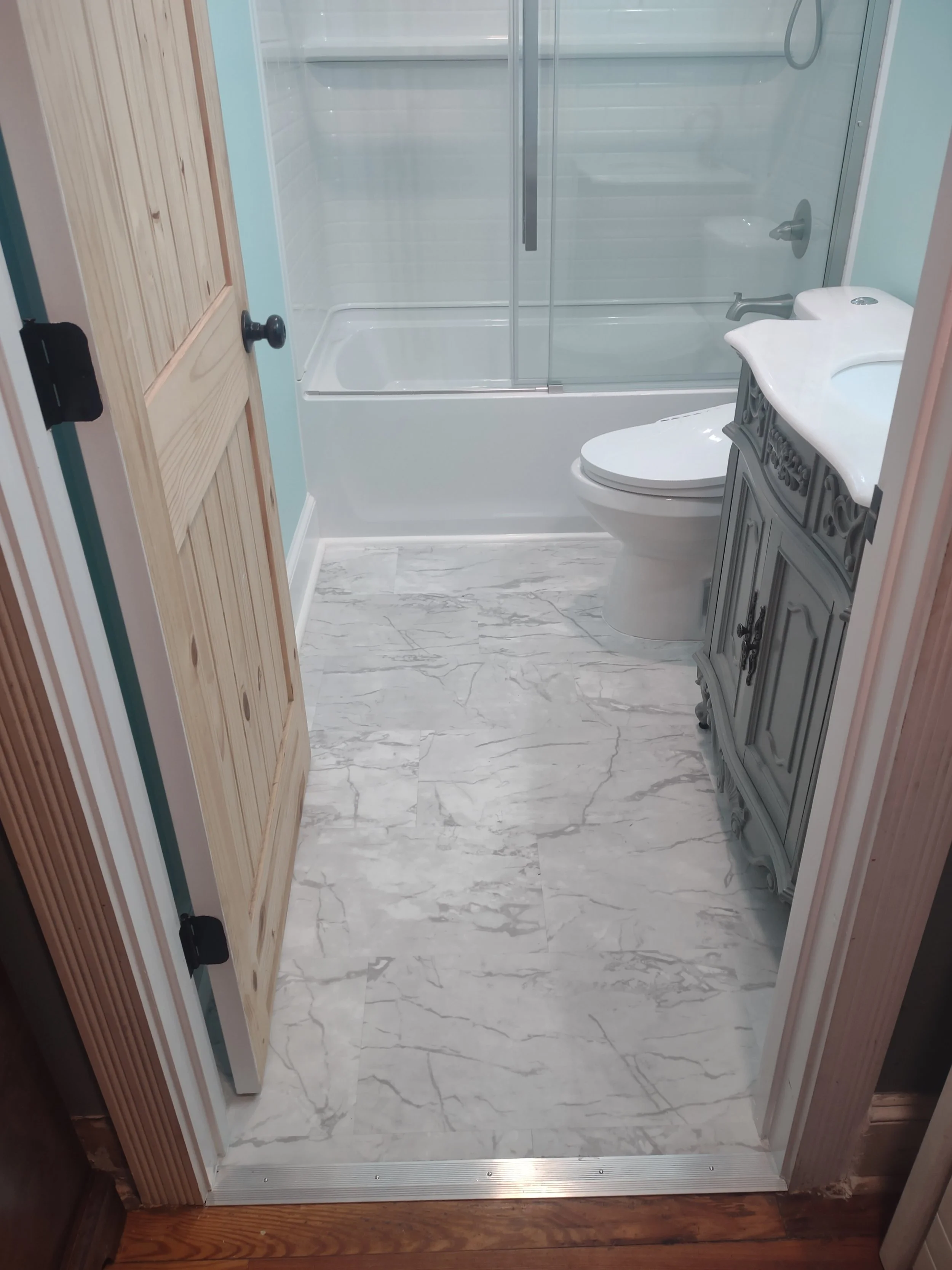 Compact full bath remodel with "true" waterproof floor