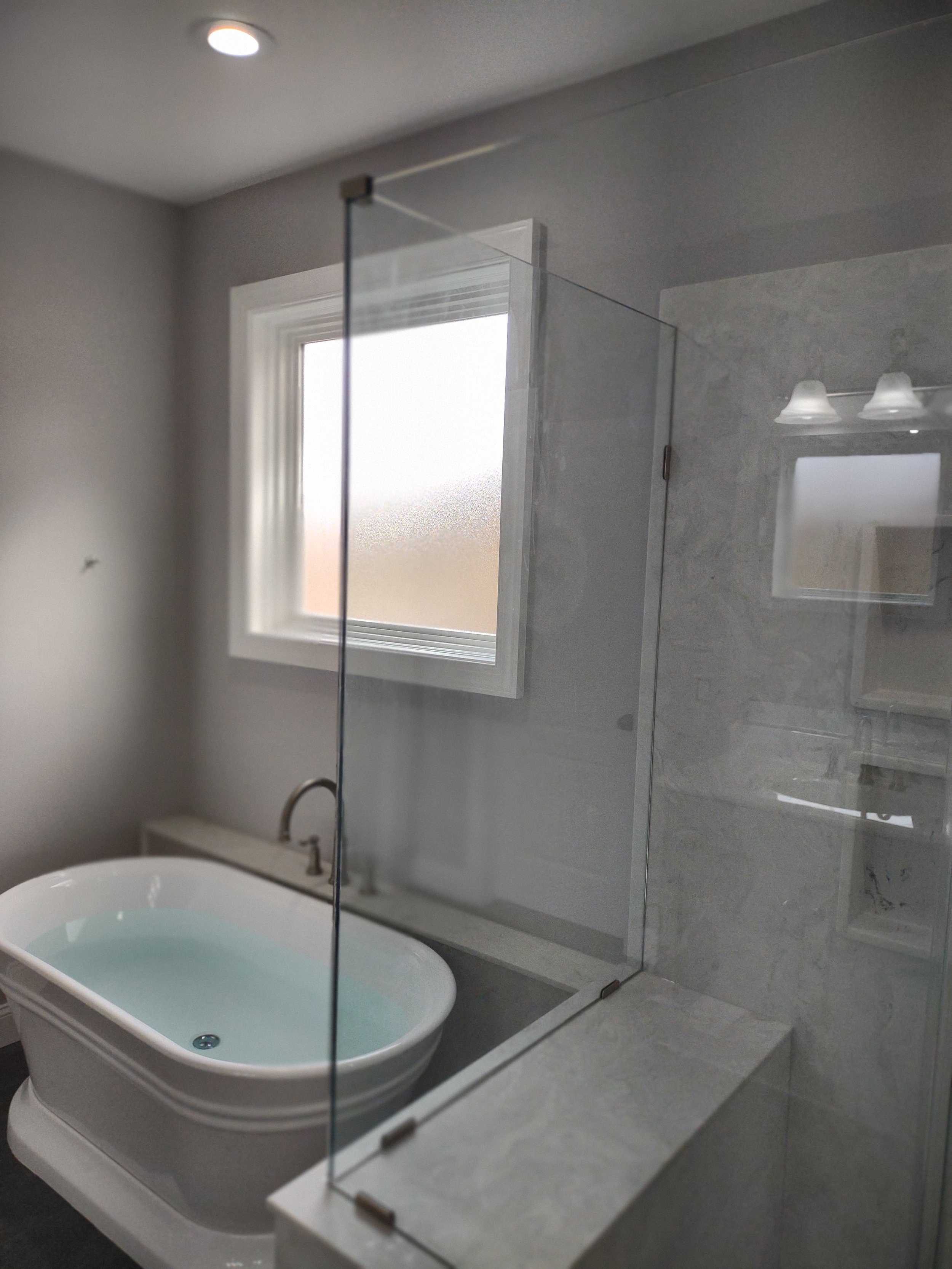 Master bathroom remodelwith a freestanding bathtub and a separate shower
