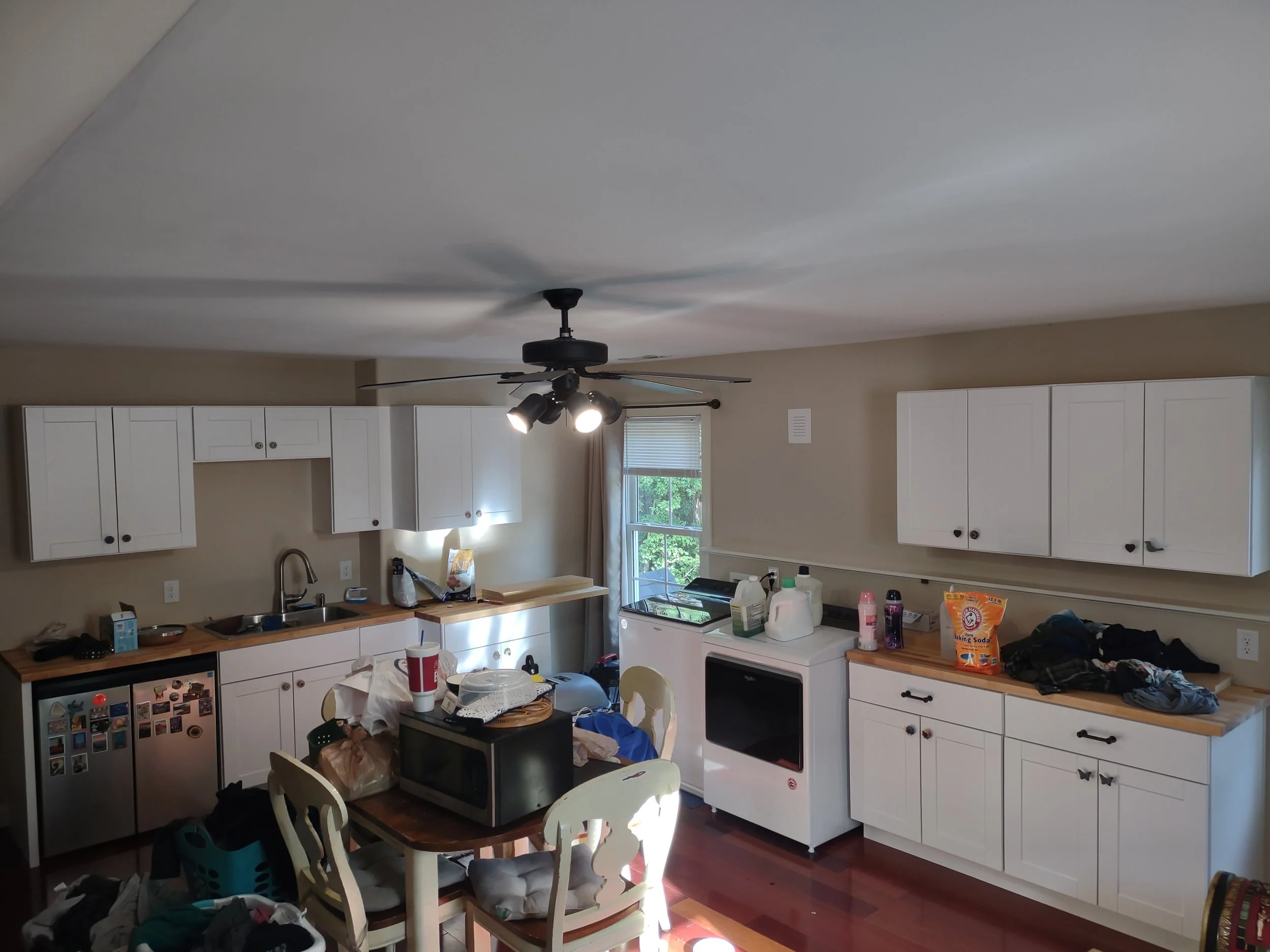 Kitchenette and laundry added to above garage bonus room to create and efficiency living area.