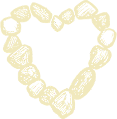 A heart-shaped outline made of various stones or shells on a black background.